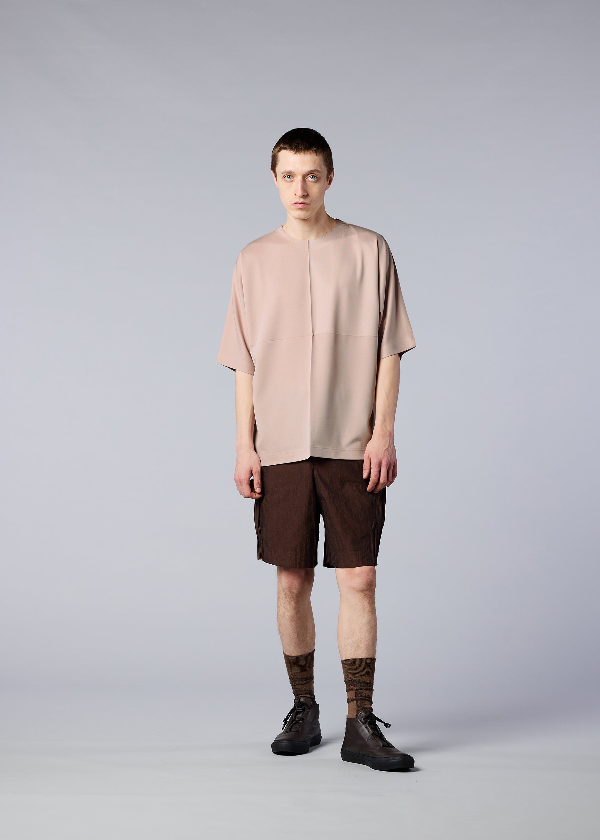 A model wears the IM MEN FLAT T top