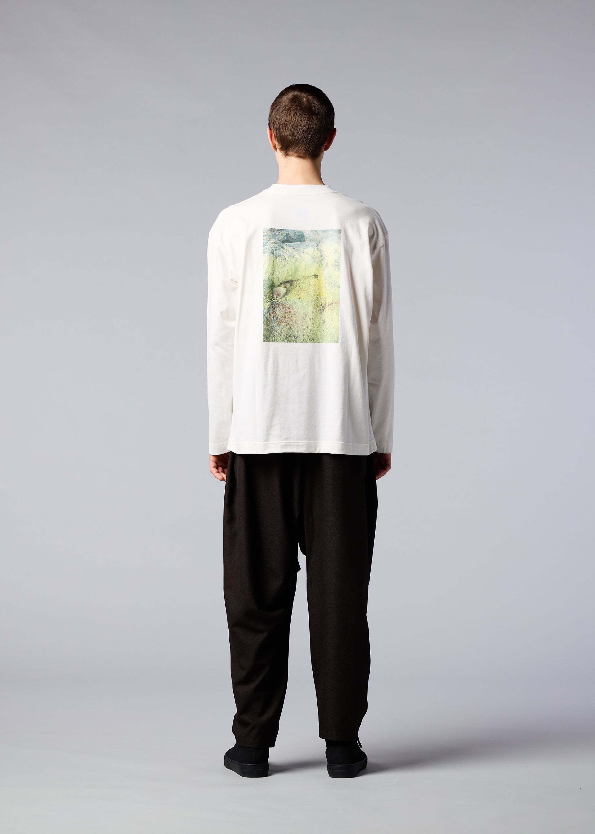 A model wears the IM MEN SOIL GRAPHIC T top.