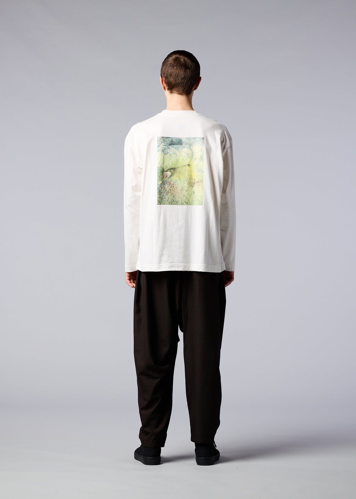 A model wears the IM MEN SOIL GRAPHIC T top.