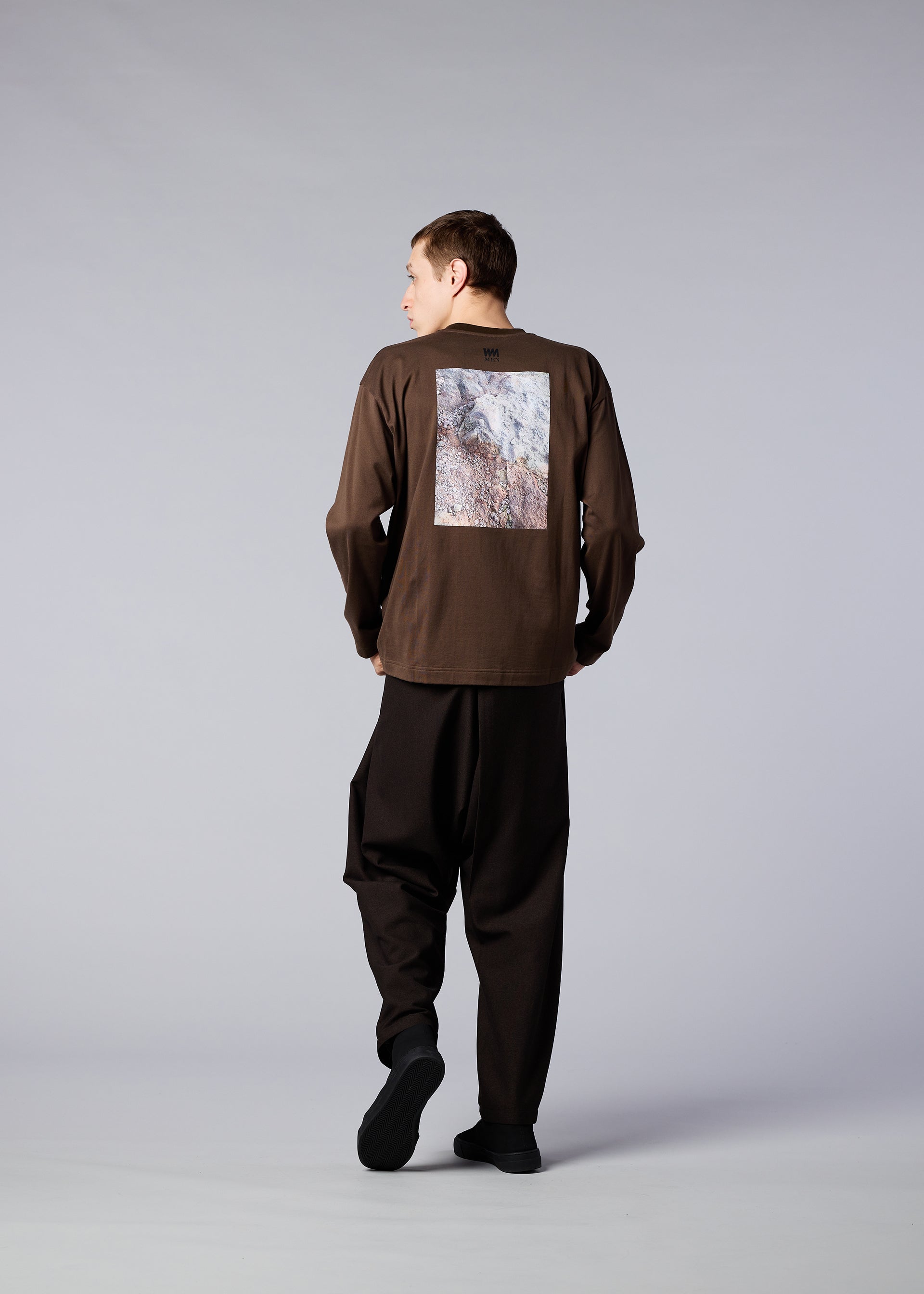 A model wears the IM MEN SOIL GRAPHIC T top.
