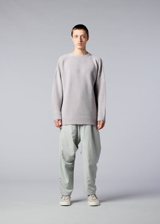 A model wears the IM MEN SEAMLESS WASHI KNIT top.