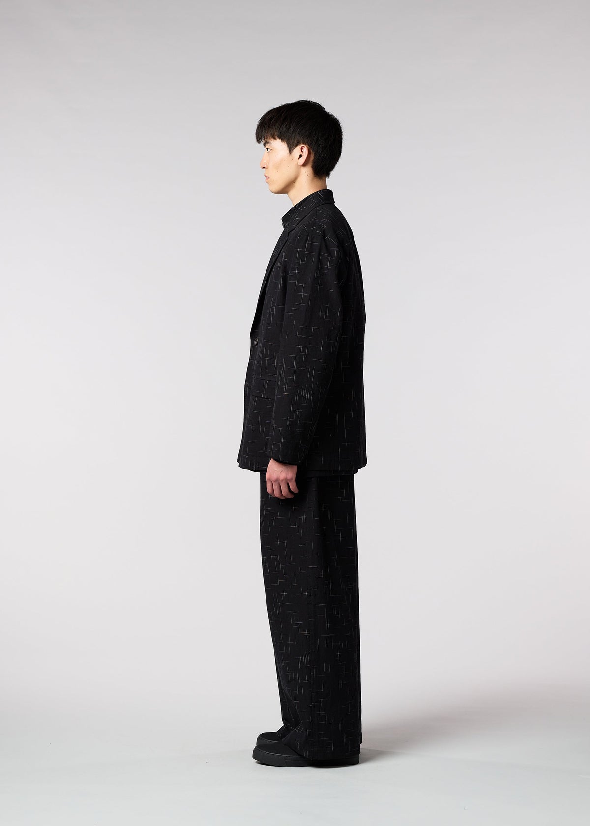 A model wears the IM MEN KASURI jacket.