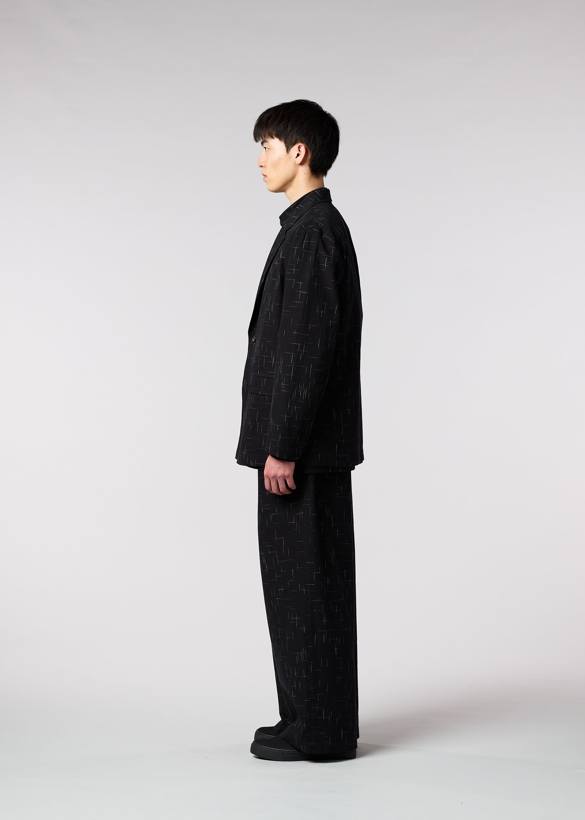 A model wears the IM MEN KASURI jacket.