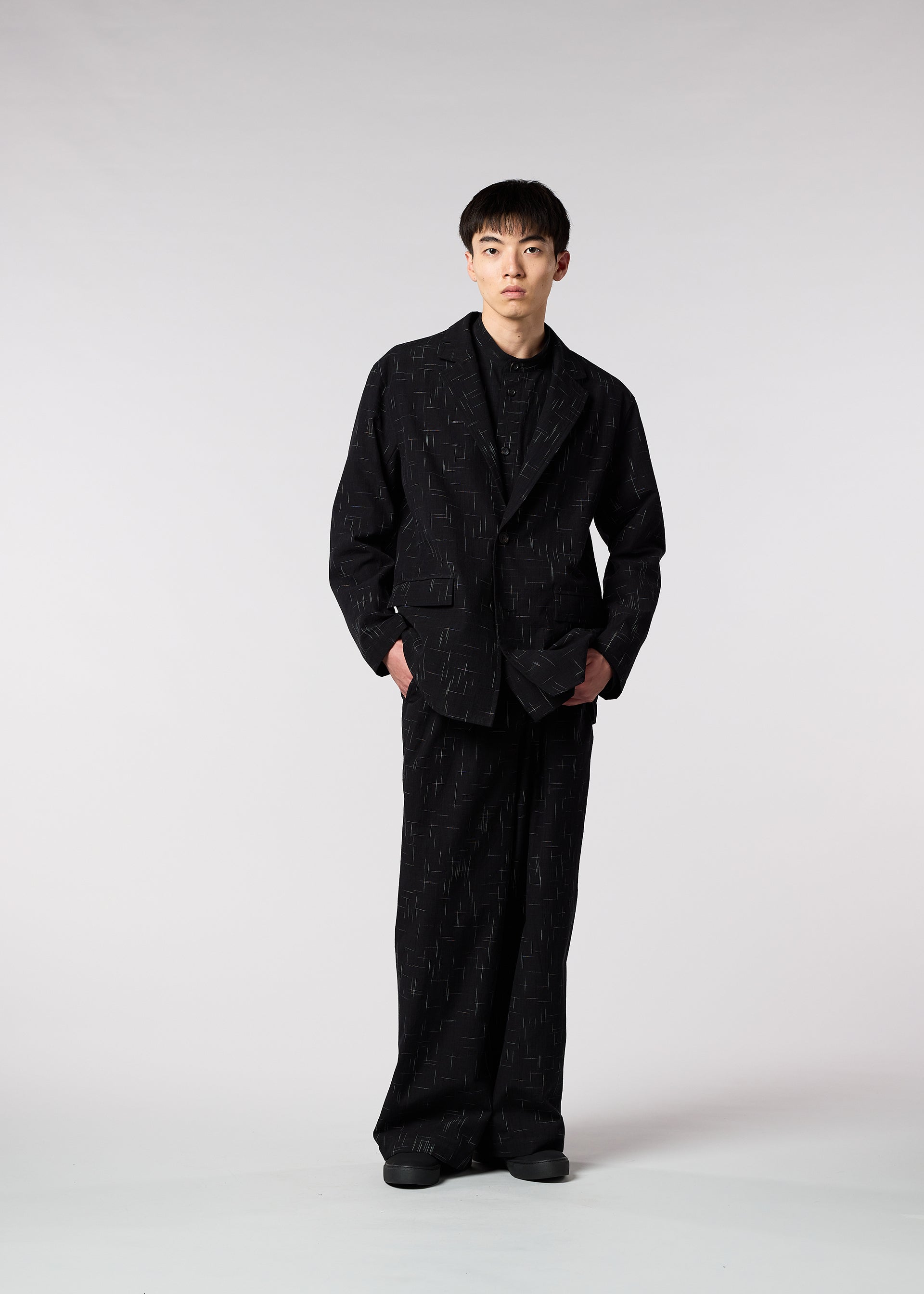A model wears the IM MEN KASURI jacket.