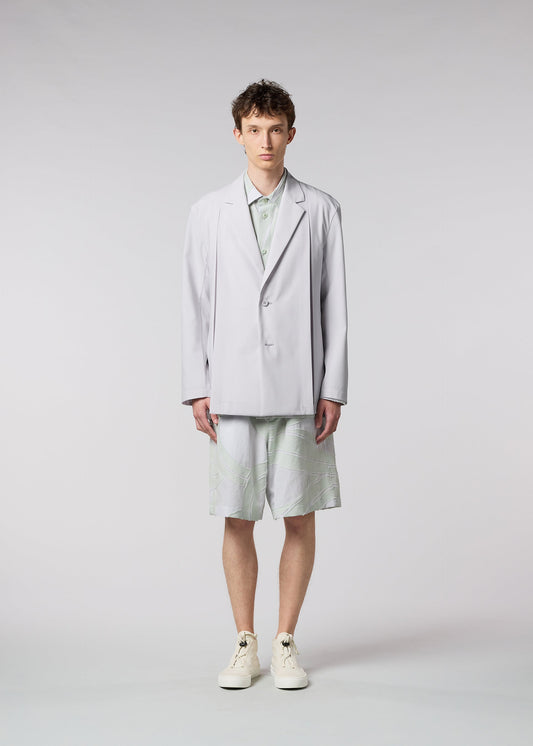 A model wears the ISSEY MIYAKE MEN WINGS jacket.