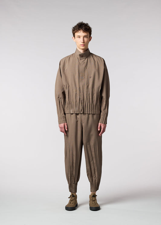 A model wears the IM MEN WAFT trousers.