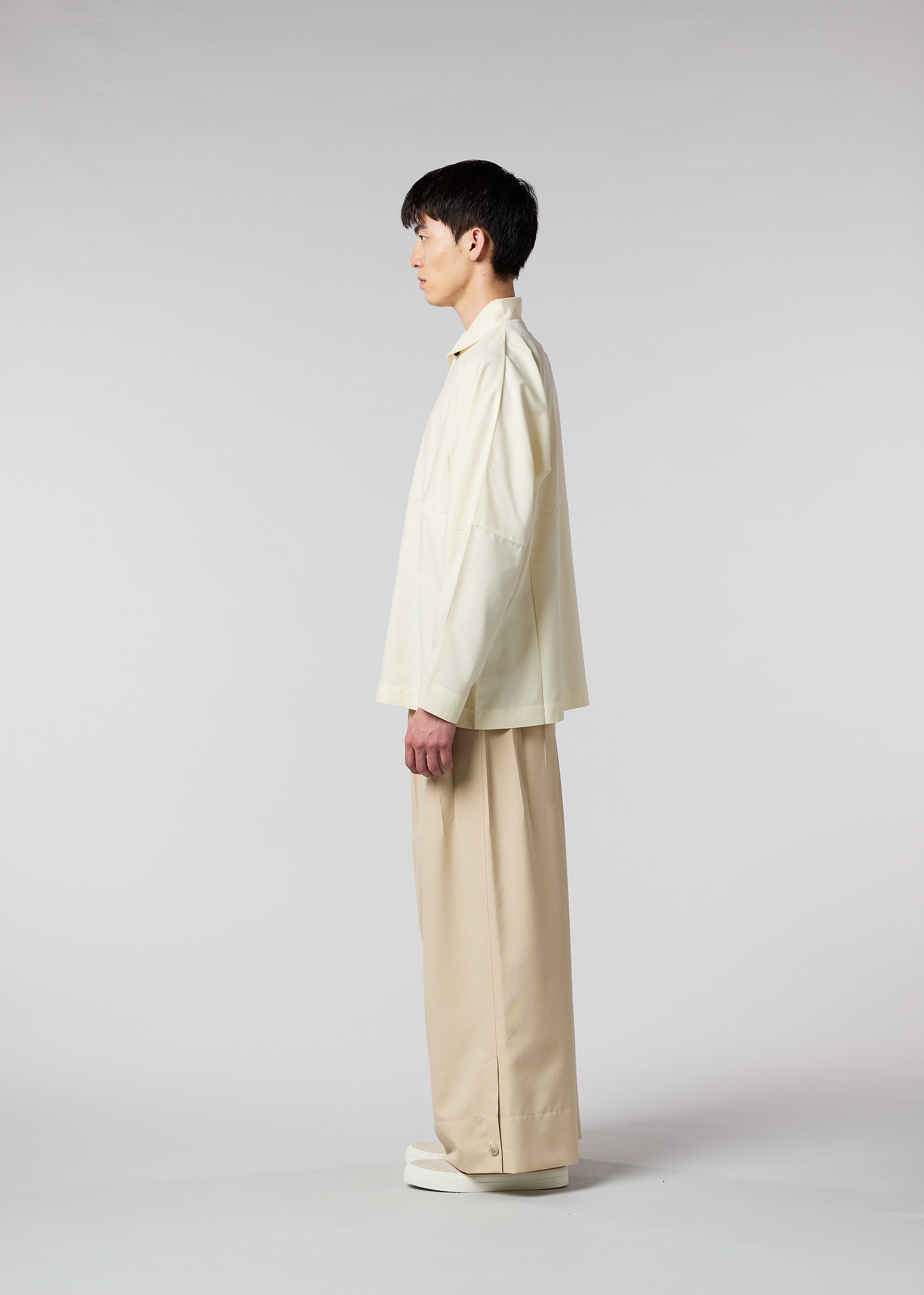 A model wears the IM MEN WAFT trousers.