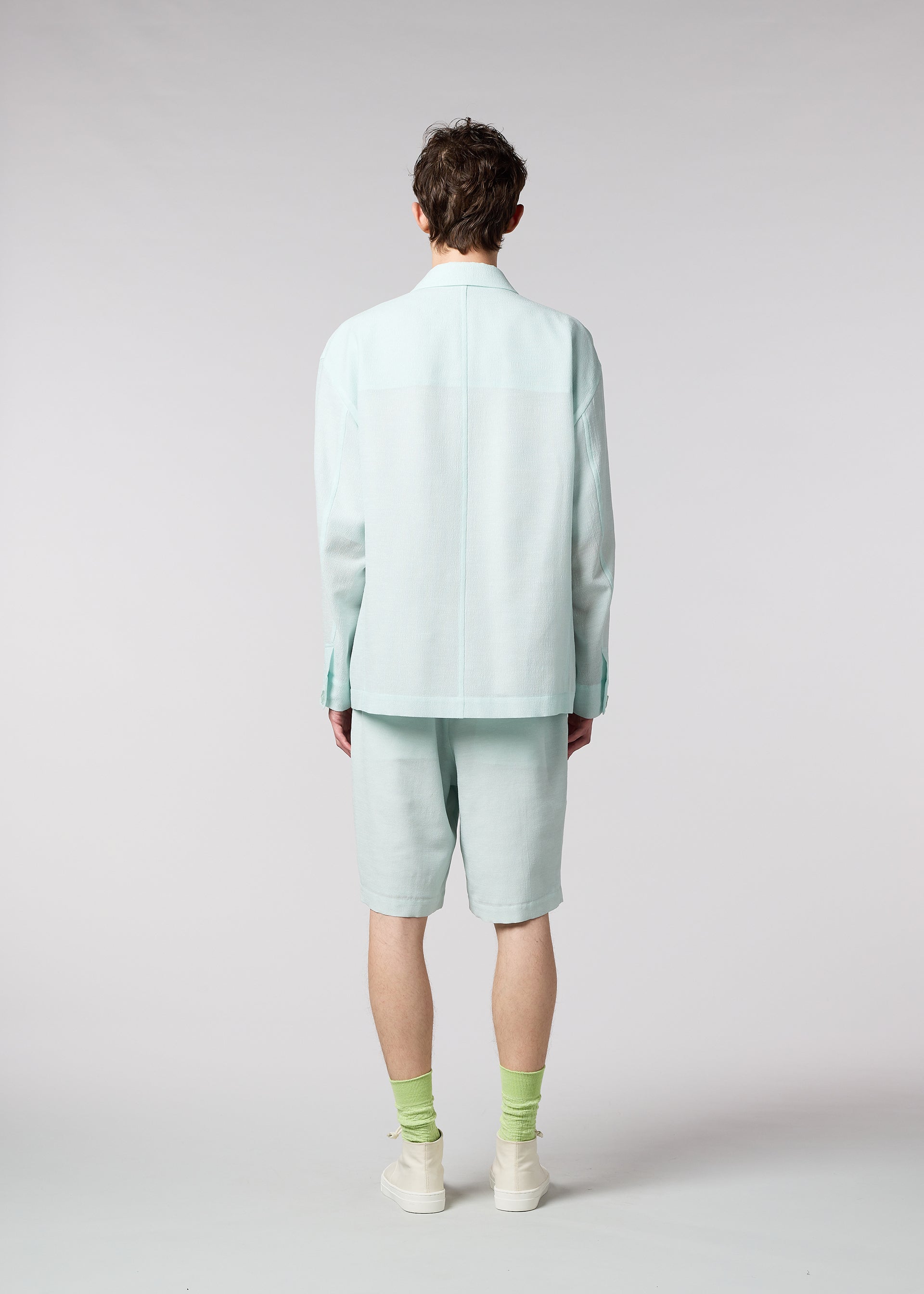 A model wears the IM MEN LUCID trousers.