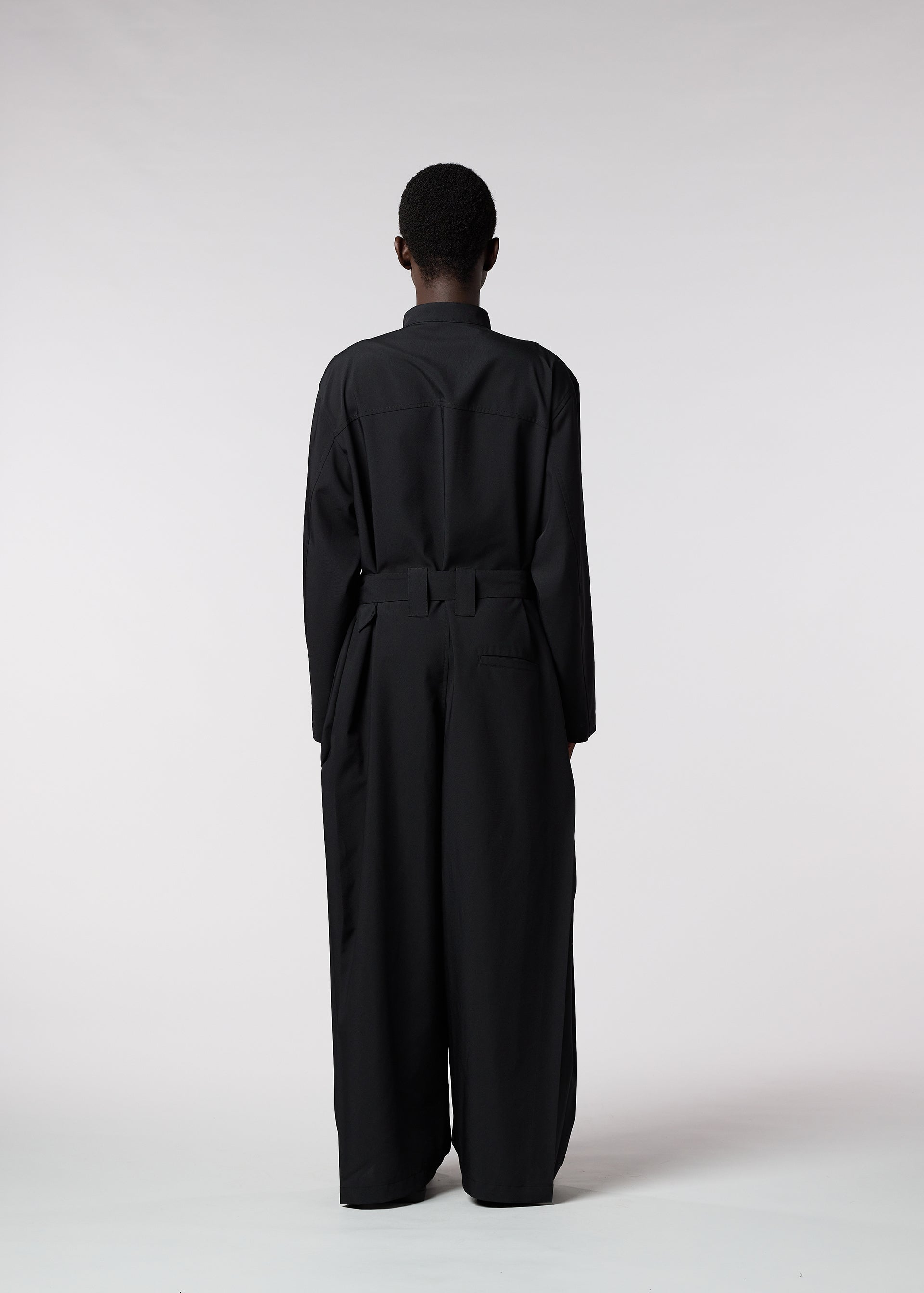 A model wears the ISSEY MIYAKE MEN WINGS jumpsuit.