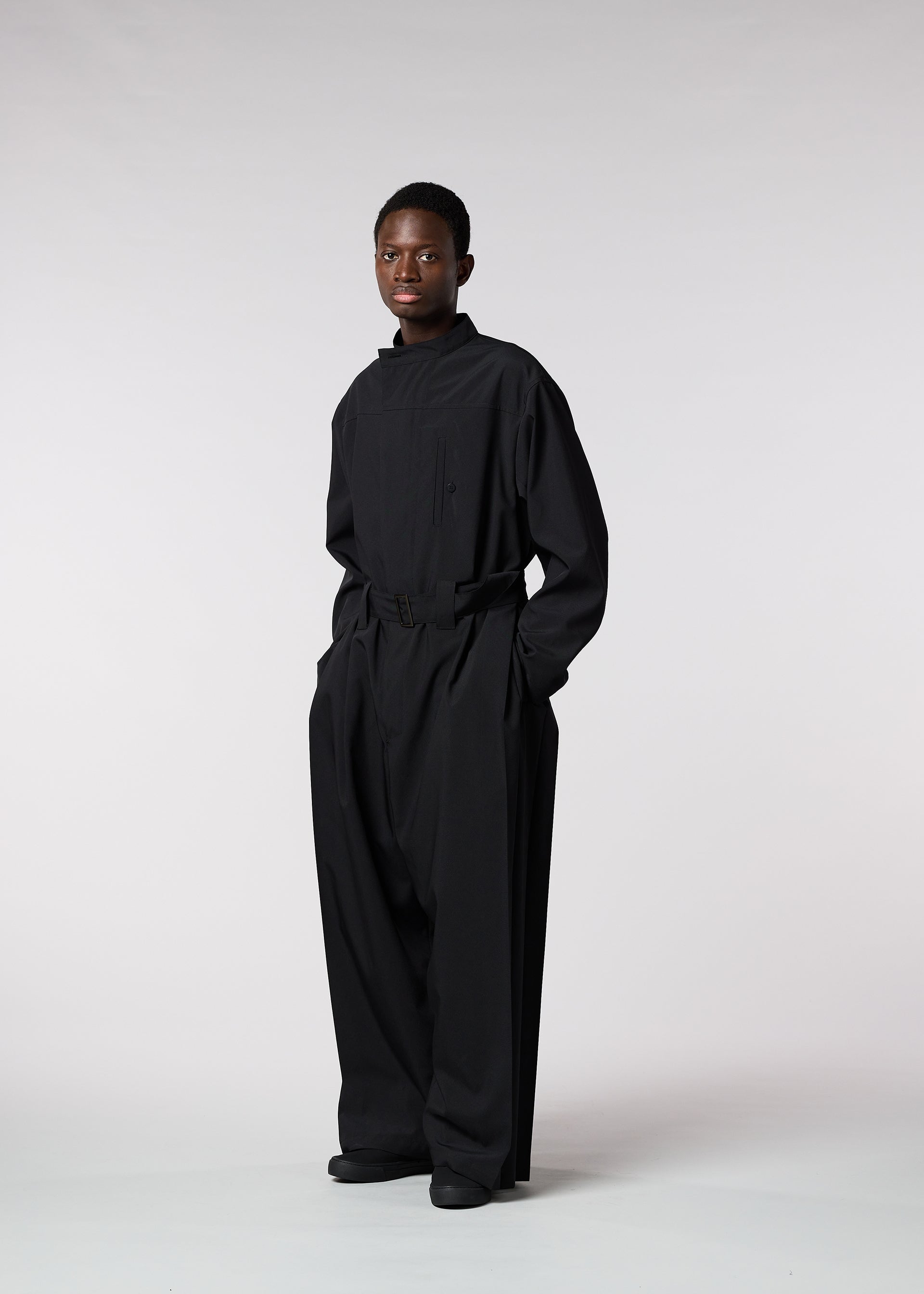 A model wears the ISSEY MIYAKE MEN WINGS jumpsuit.