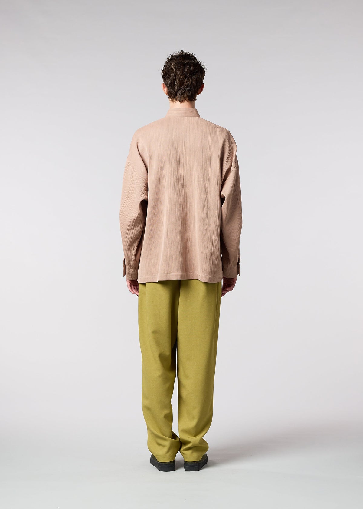 A model wears the IM MEN DOUBLE WEAVE CREPE shirt.