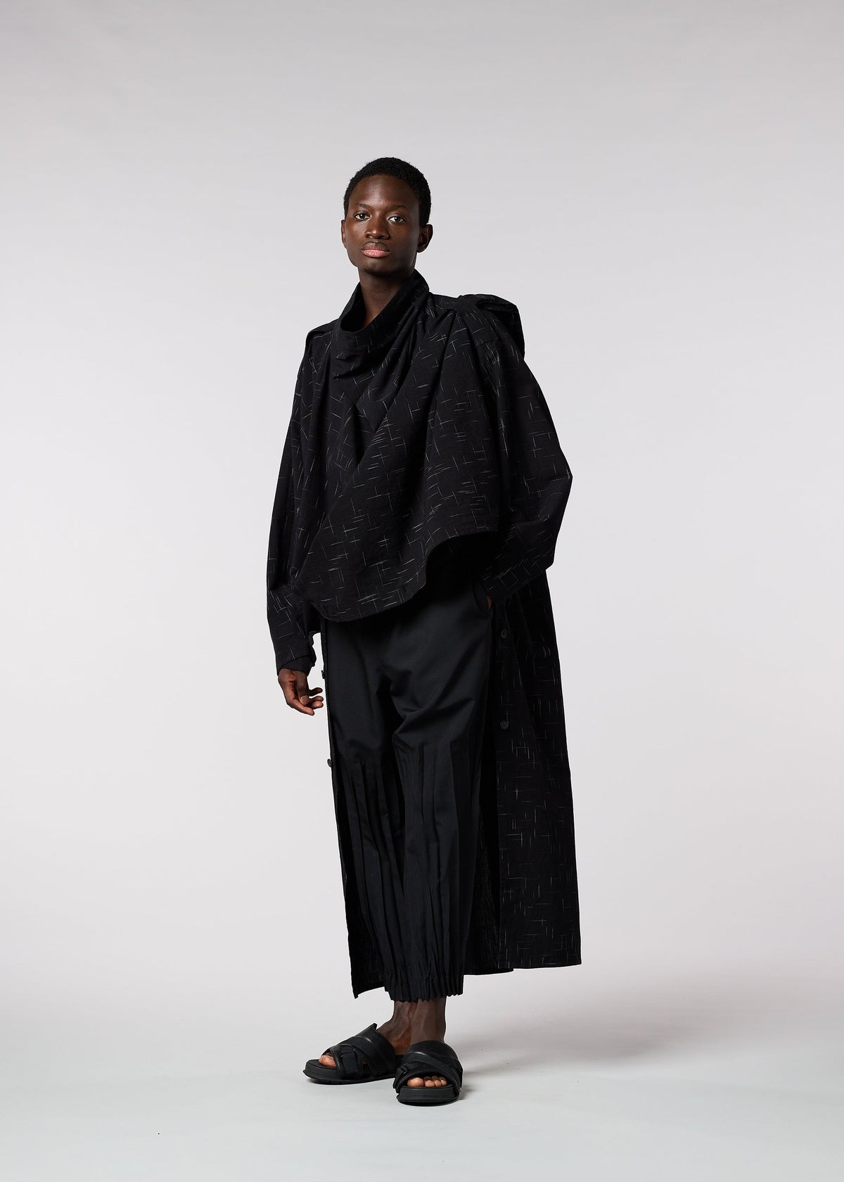 A model wears the IM MEN KASURI shirt.