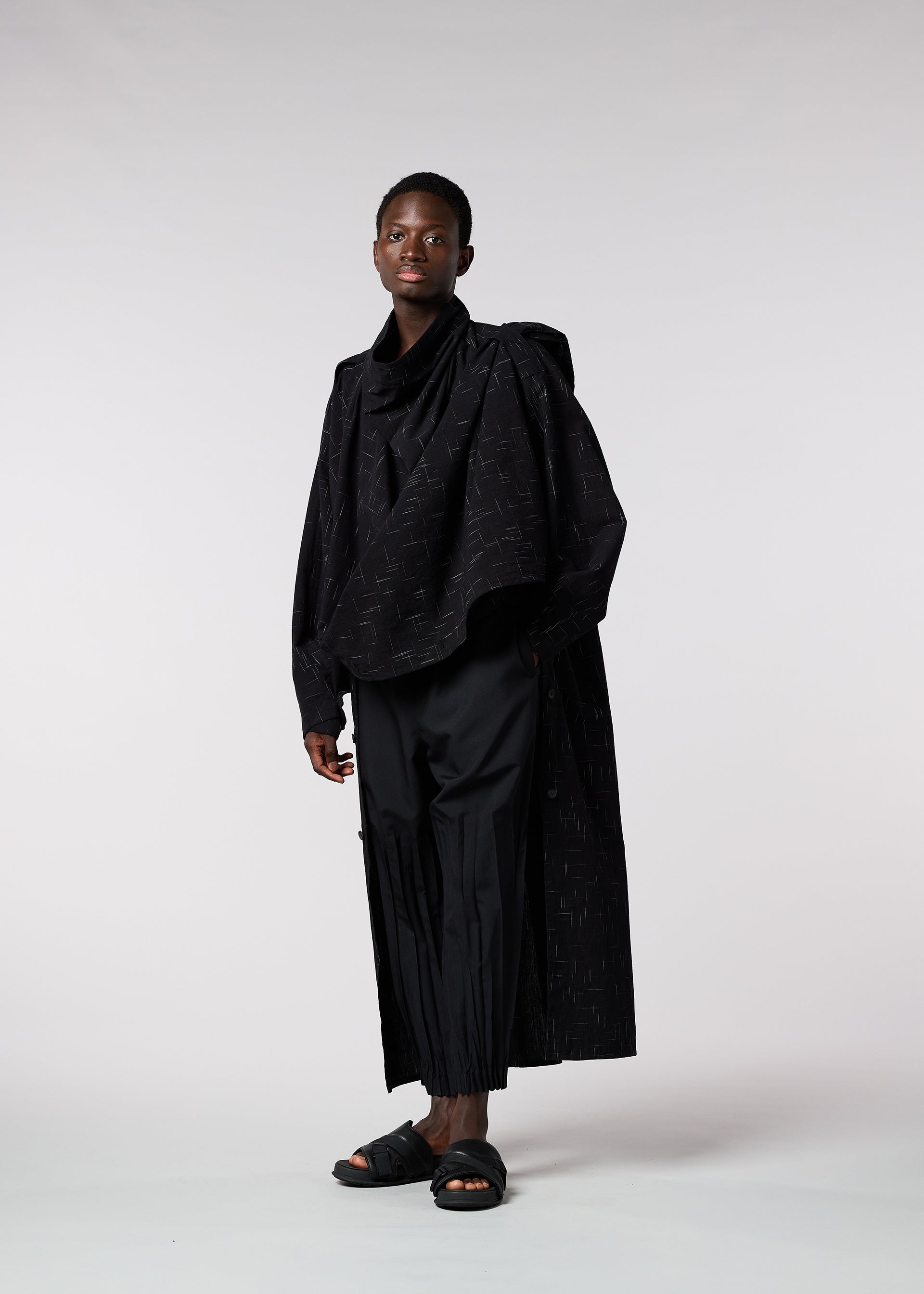 A model wears the IM MEN KASURI shirt.