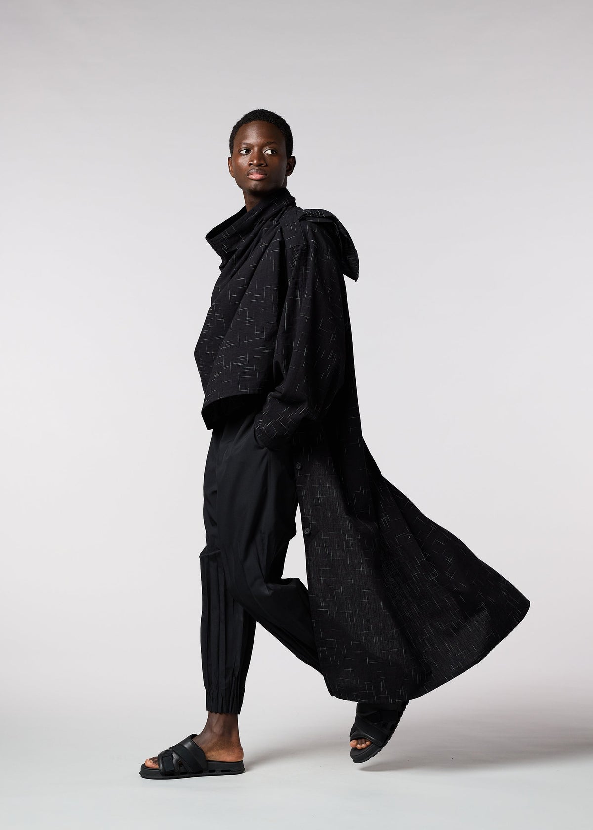 A model wears the IM MEN KASURI shirt.