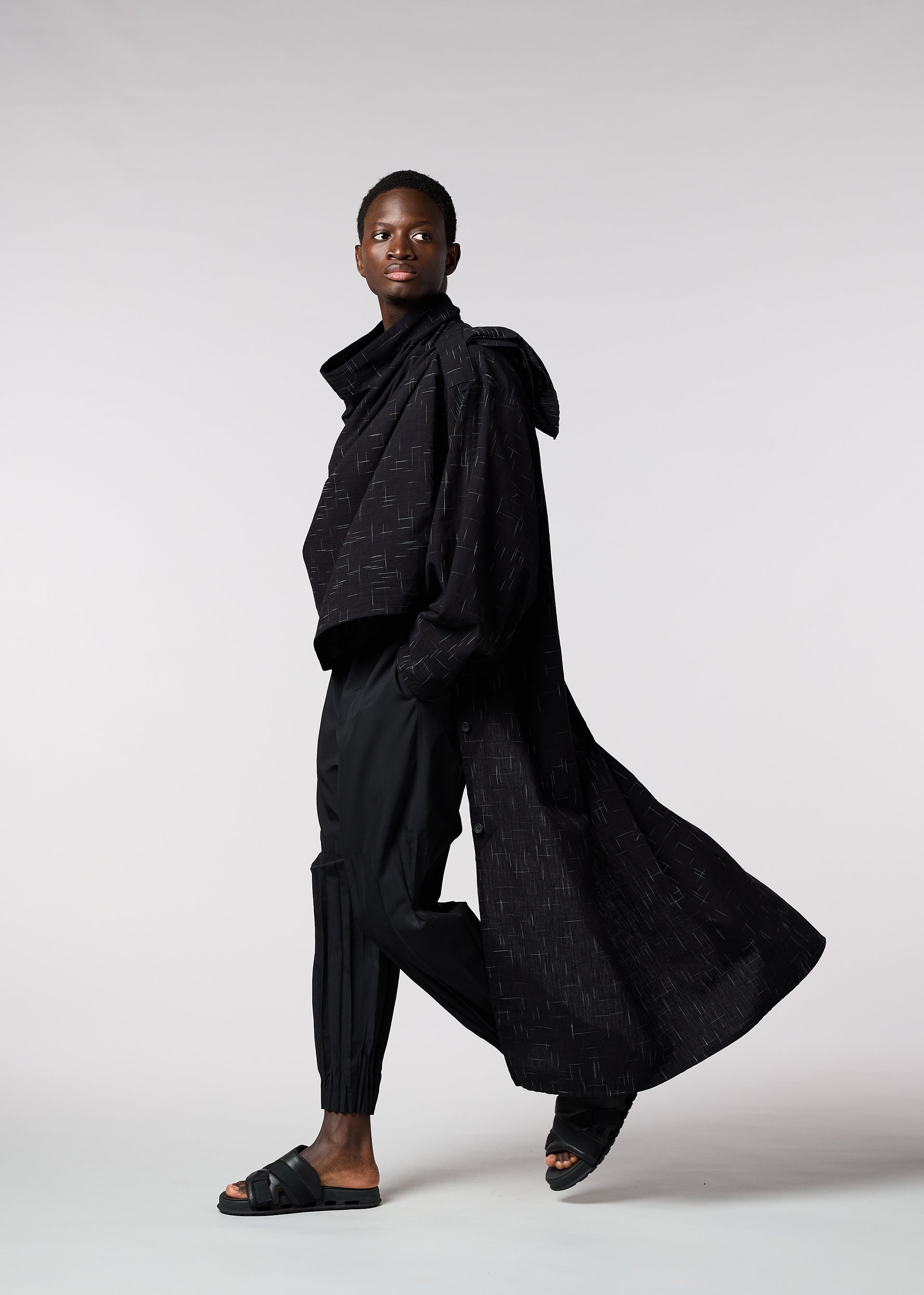 A model wears the IM MEN KASURI shirt.