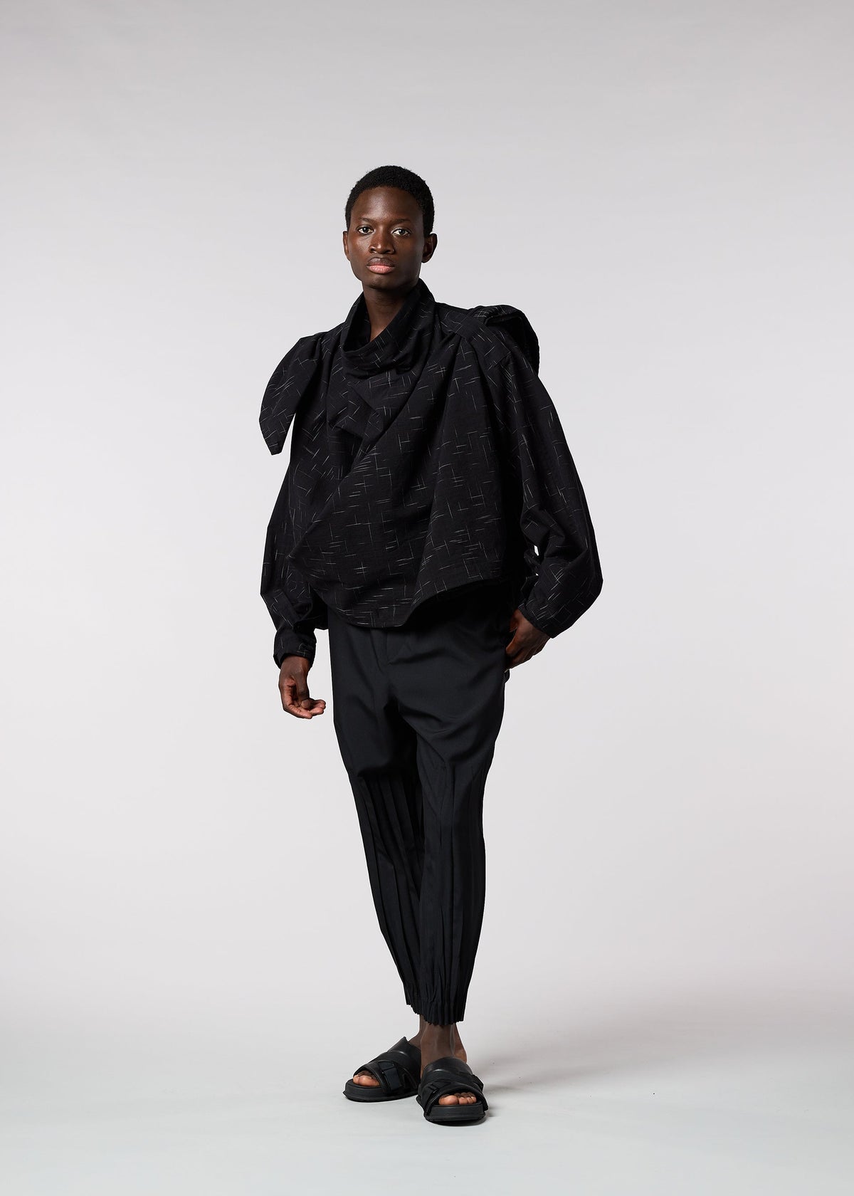 A model wears the IM MEN KASURI shirt.