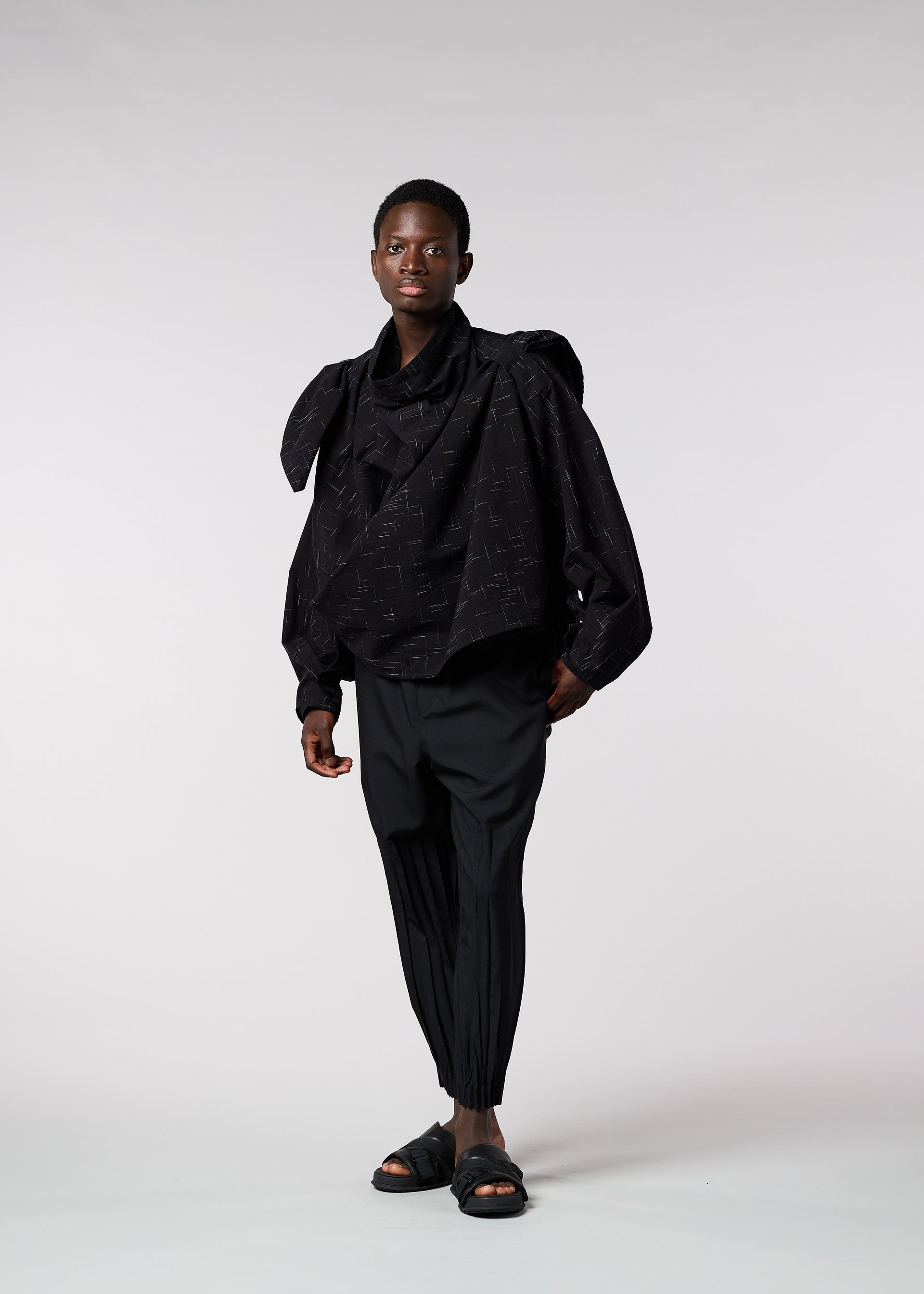A model wears the IM MEN KASURI shirt.