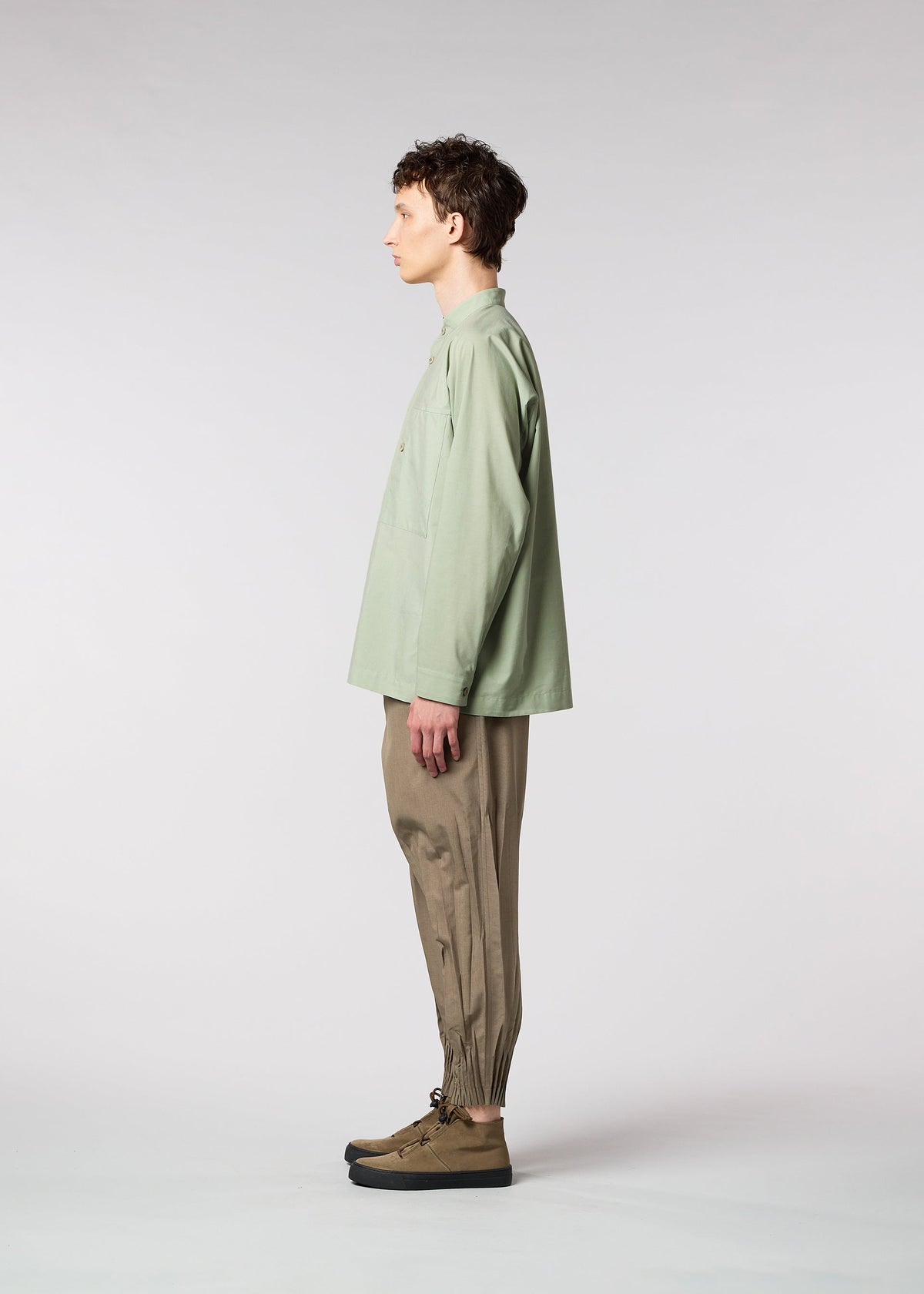 A model wears the IM MEN ONE CUT SHIRT shirt.