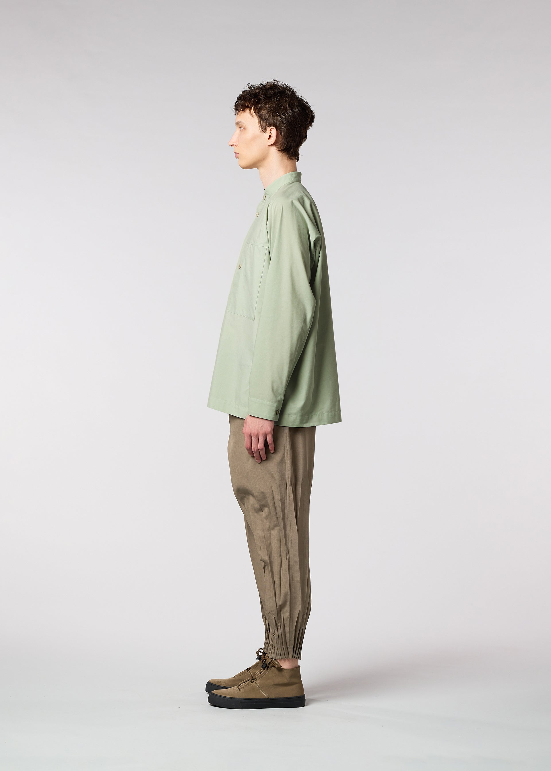 A model wears the IM MEN ONE CUT SHIRT shirt.