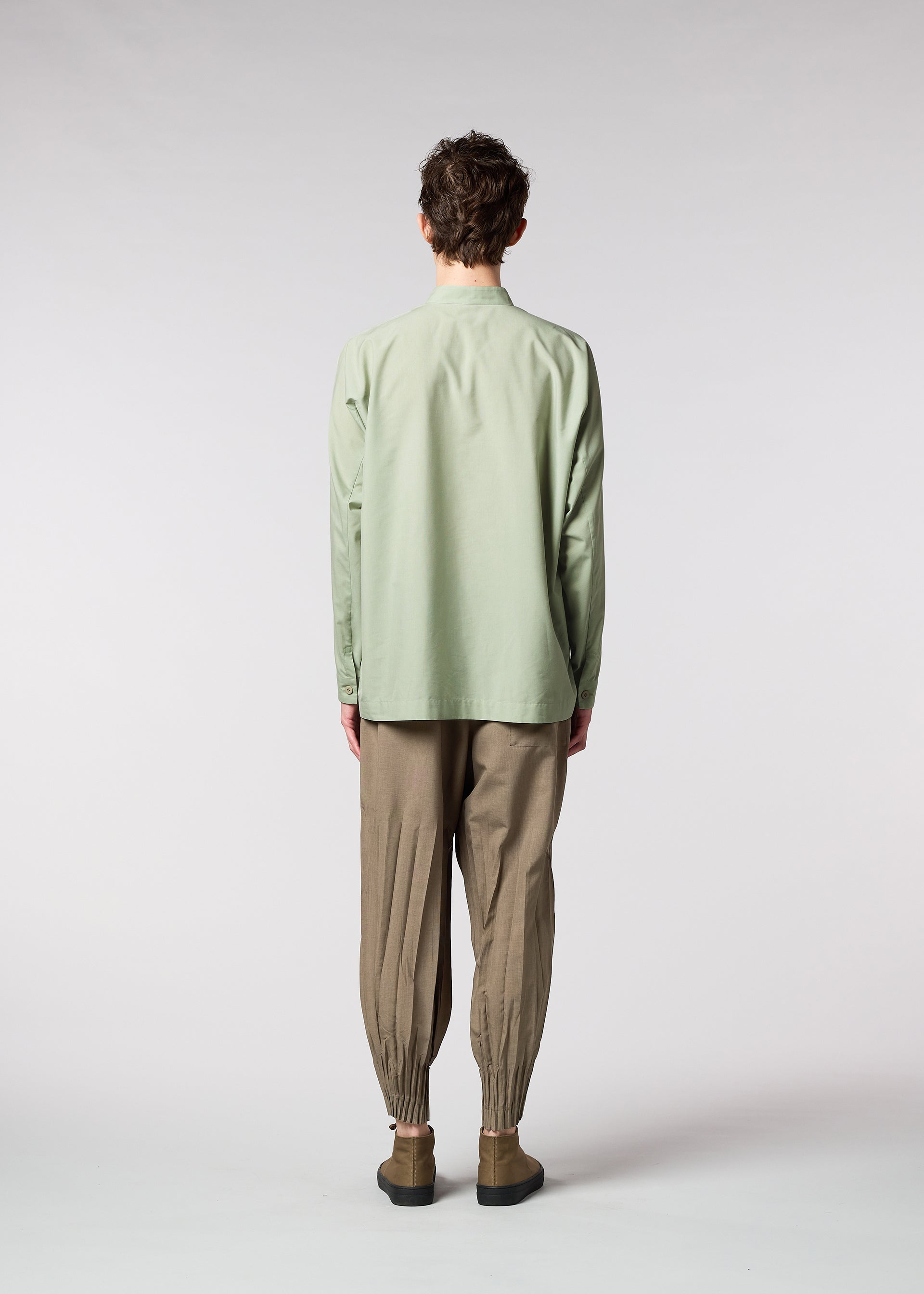 A model wears the IM MEN ONE CUT SHIRT shirt.