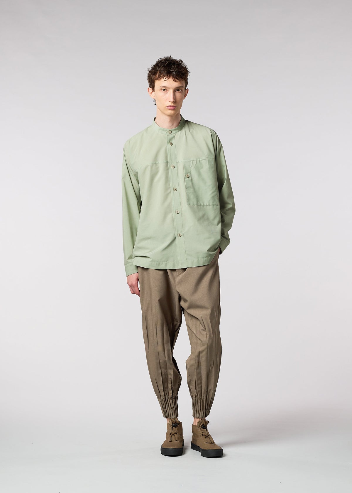A model wears the IM MEN ONE CUT SHIRT shirt.