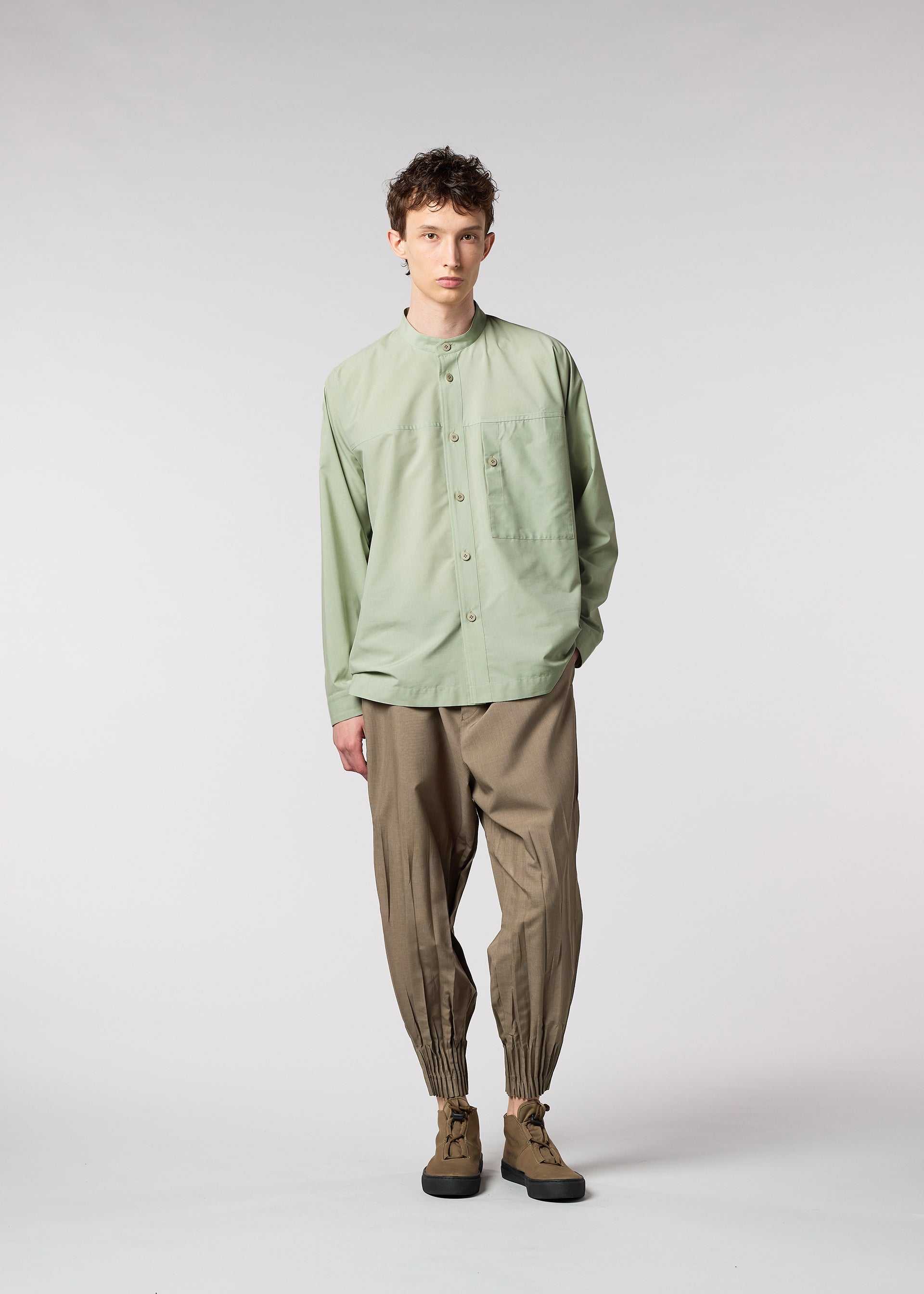 A model wears the IM MEN ONE CUT SHIRT shirt.