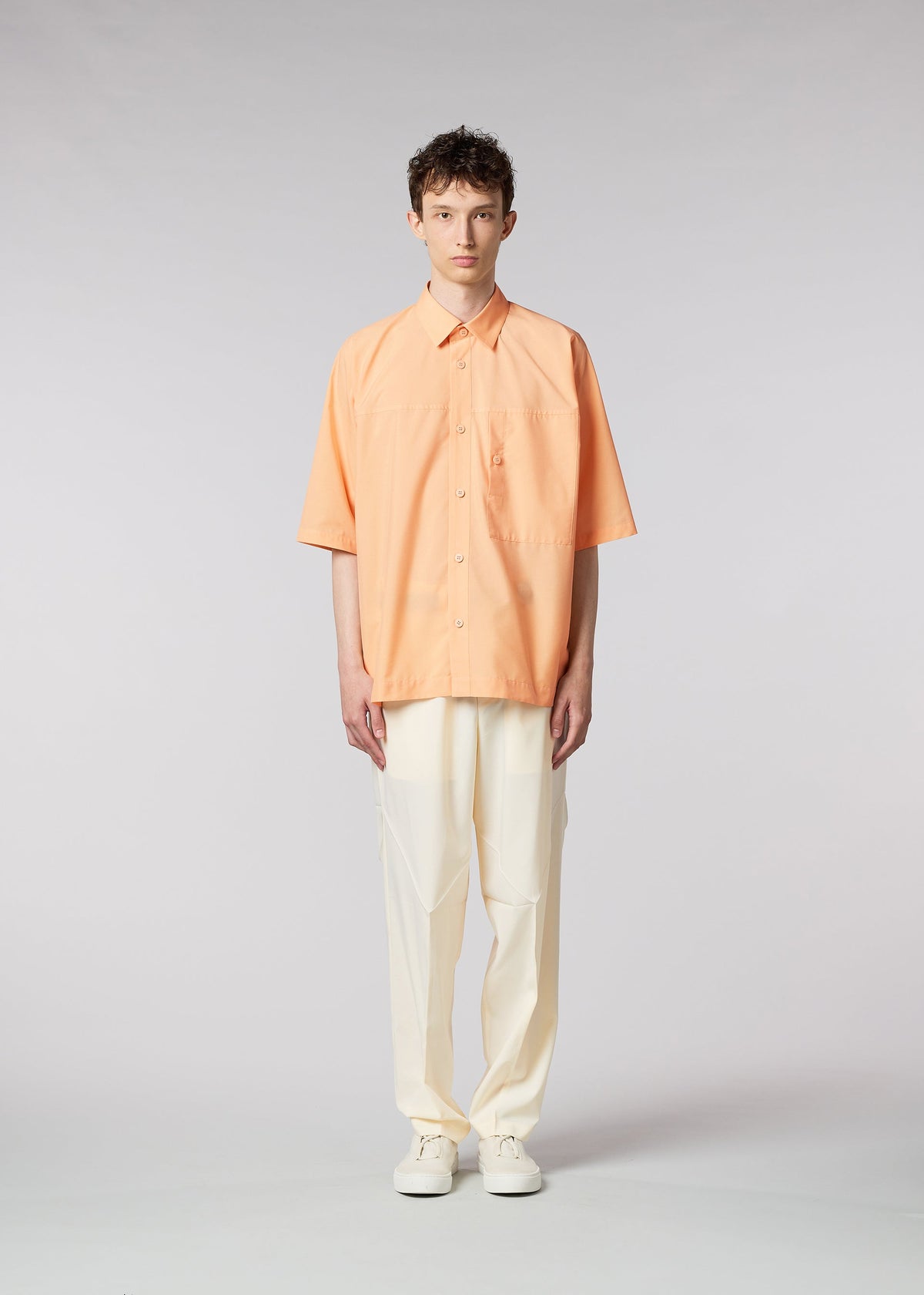 A model wears the IM MEN ONE CUT SHIRT shirt.
