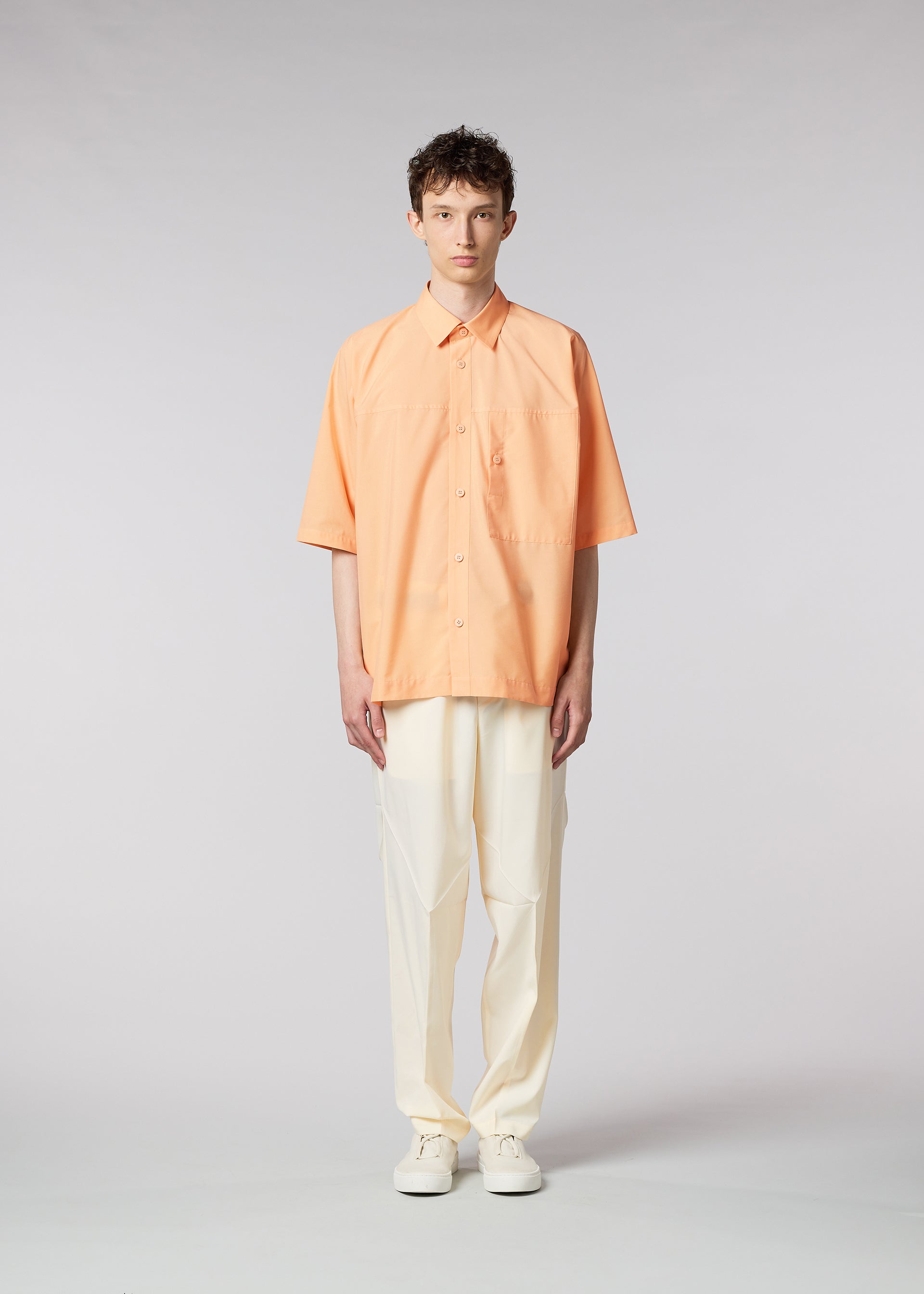 A model wears the IM MEN ONE CUT SHIRT shirt.