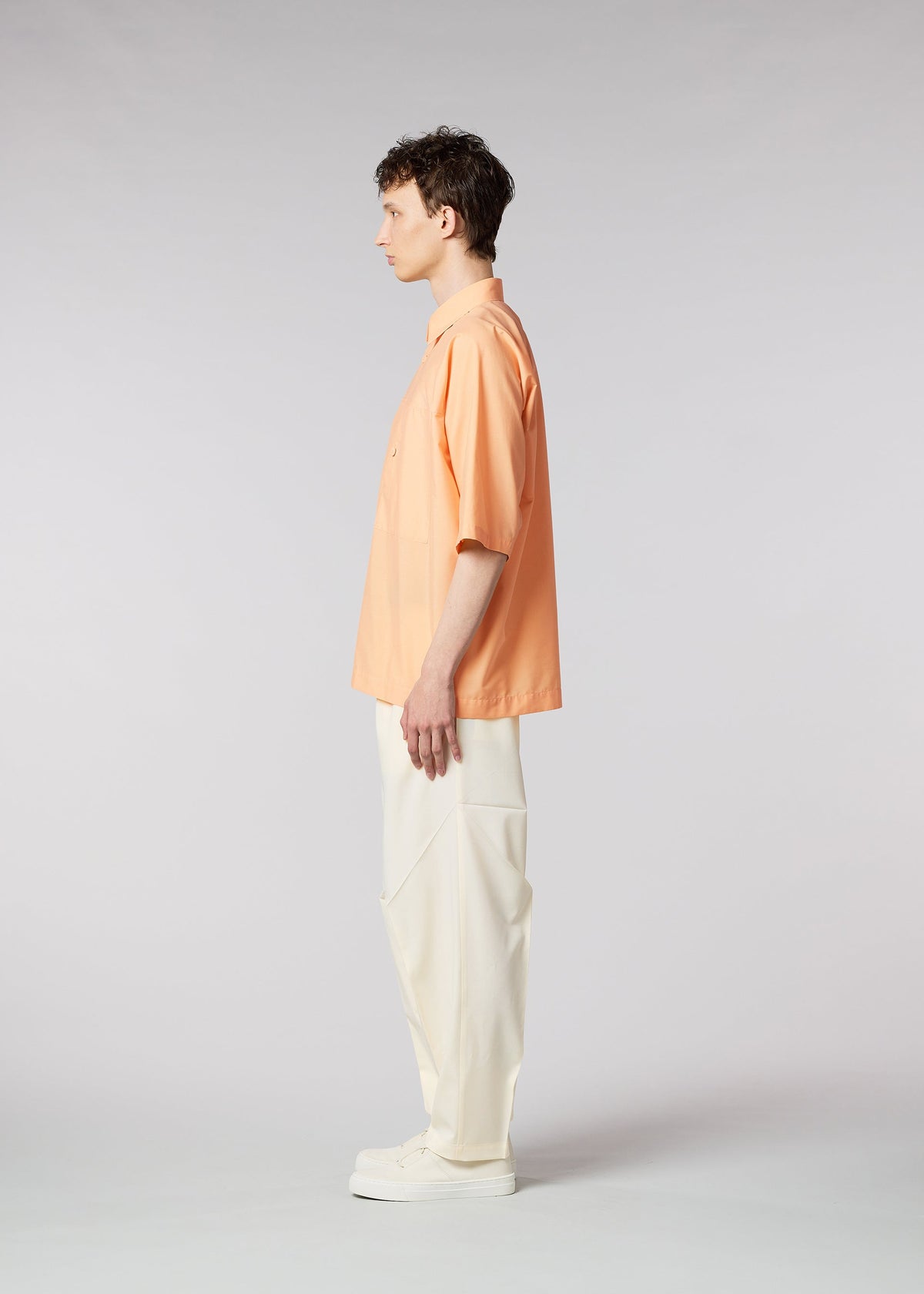 A model wears the IM MEN ONE CUT SHIRT shirt.