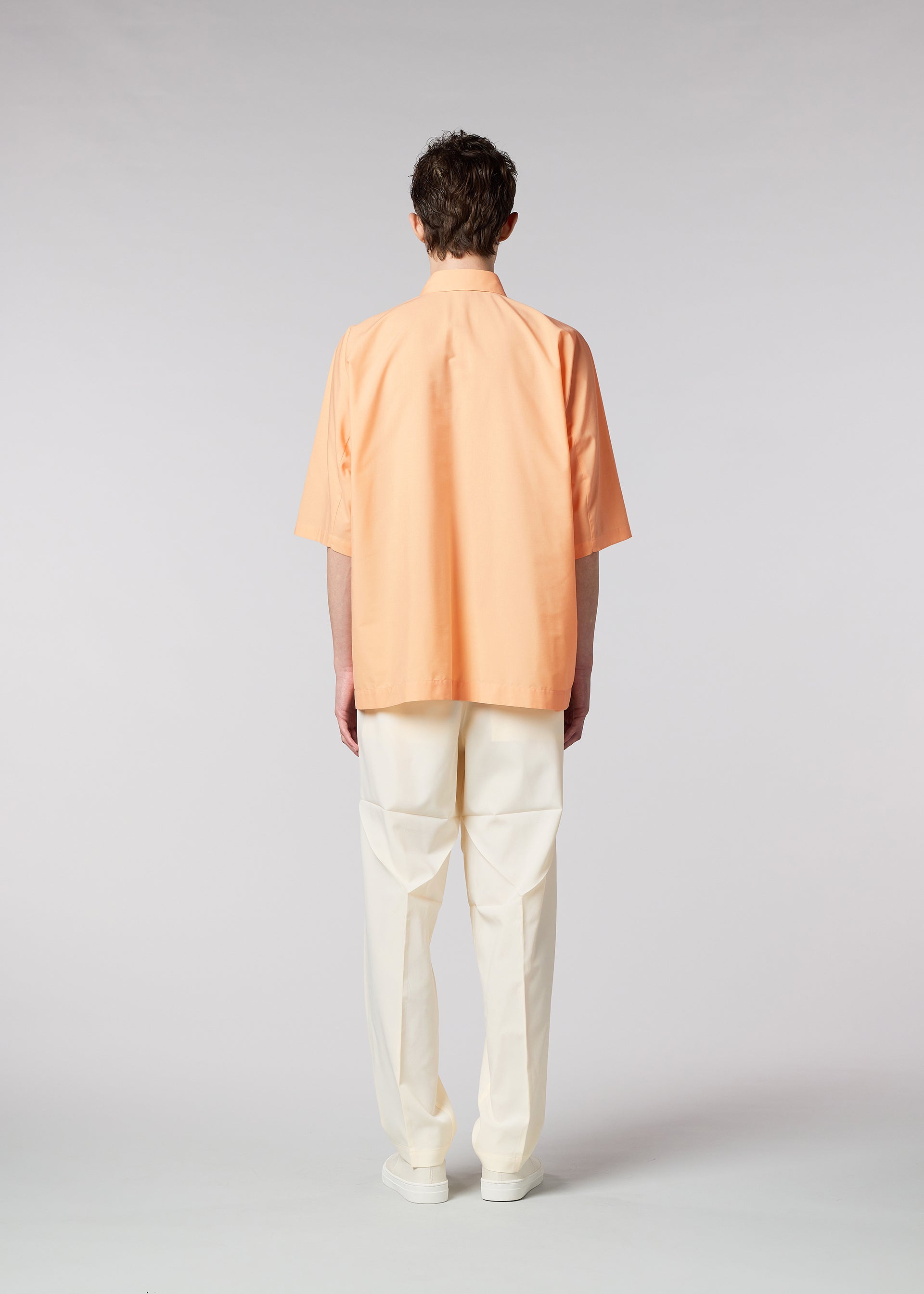 A model wears the IM MEN ONE CUT SHIRT shirt.