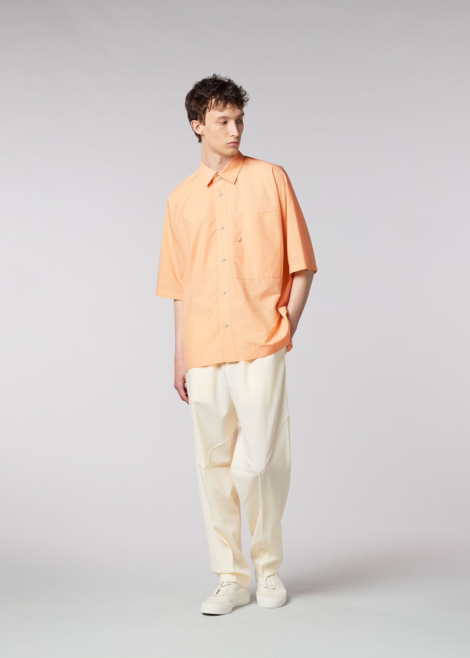 A model wears the IM MEN ONE CUT SHIRT shirt.