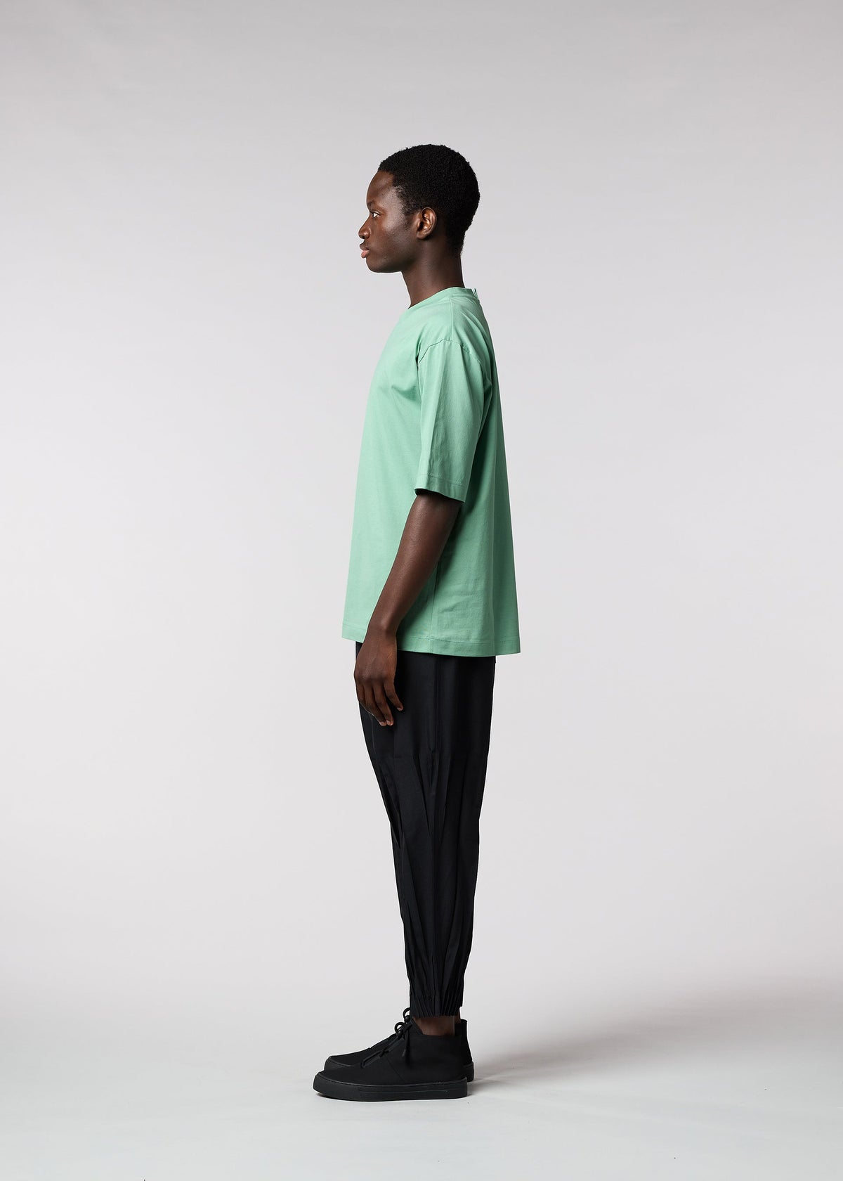 A model wears the IM MEN 60/2 JERSEY STITCH top.
