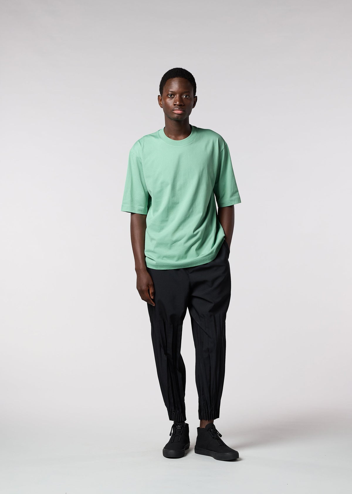 A model wears the IM MEN 60/2 JERSEY STITCH top.