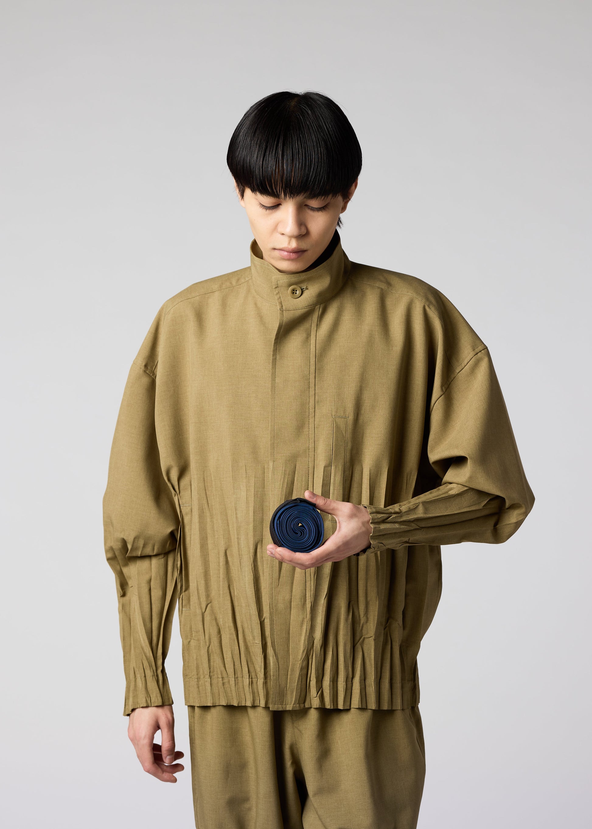 A model wears the IM MEN GURU GURU bag.