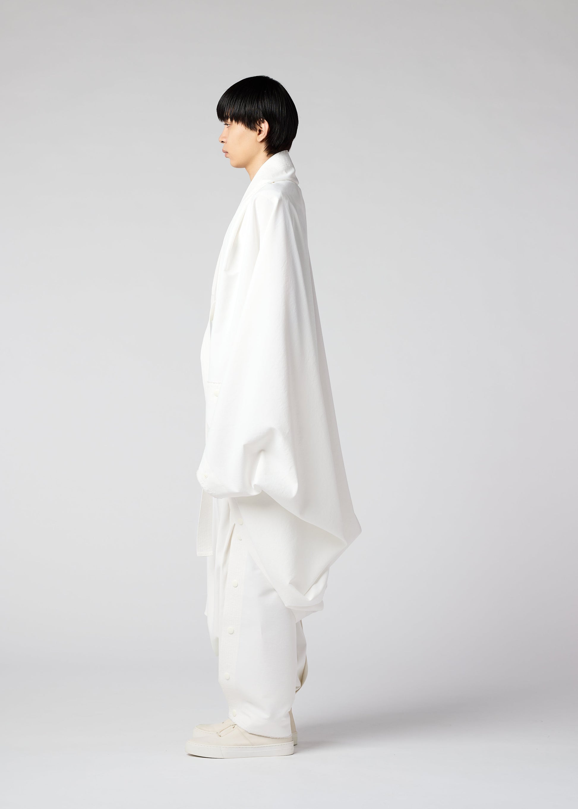 A model wears the IM MEN FLY coat.