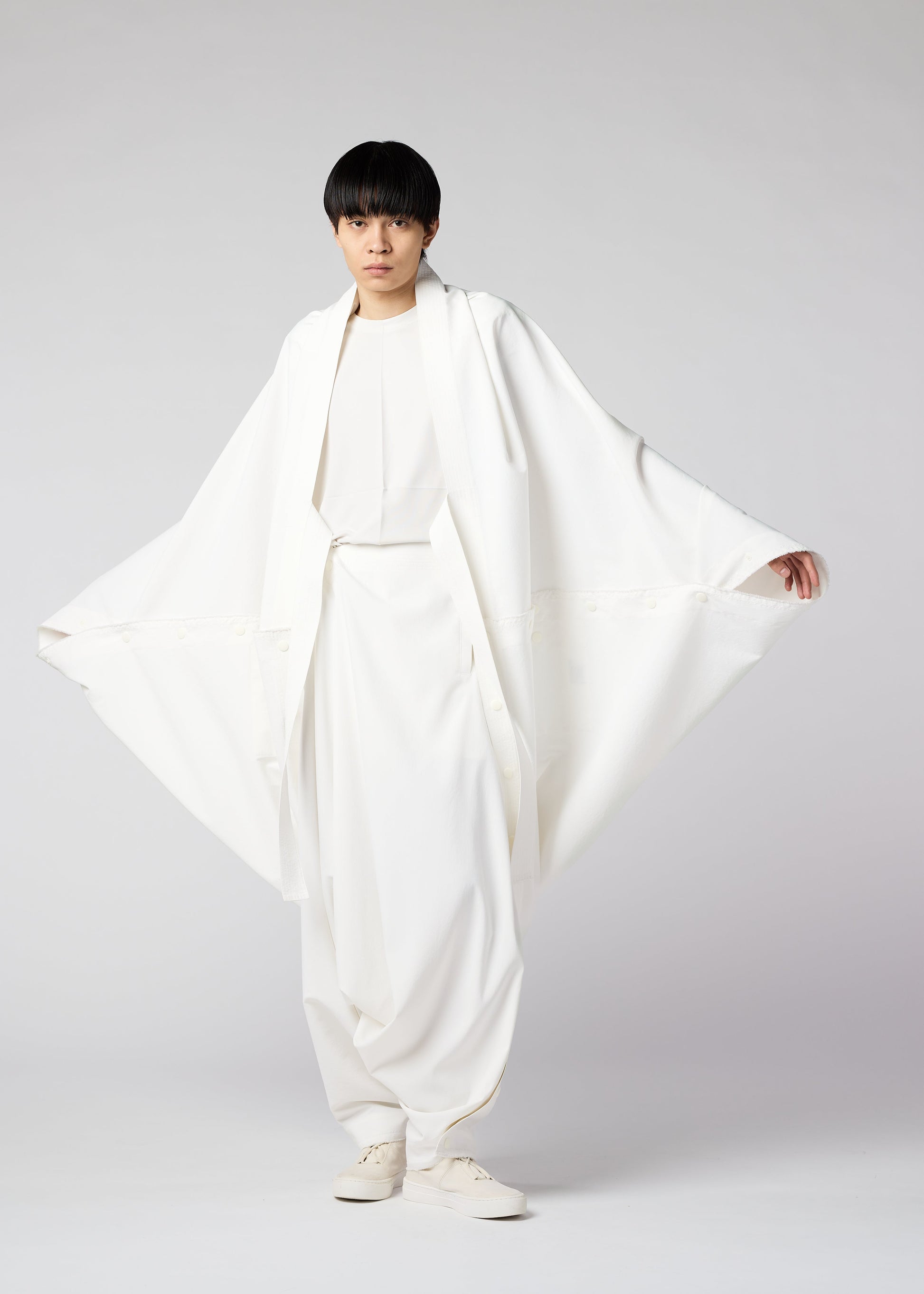 A model wears the IM MEN FLY coat.