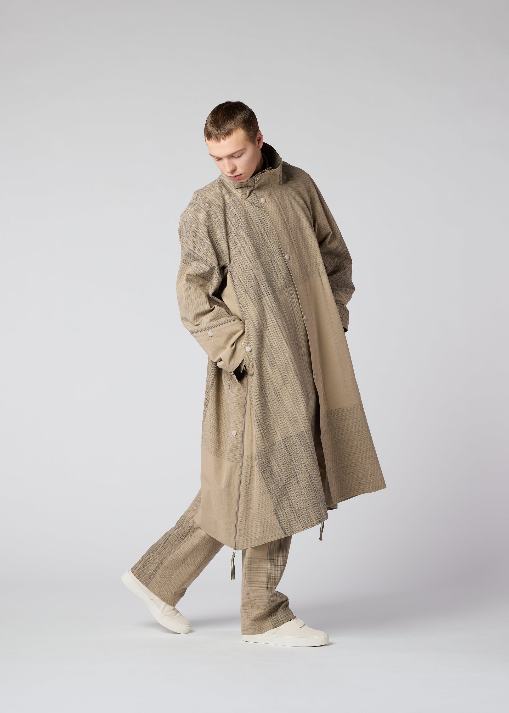 A model wears the IM MEN KASURI coat.