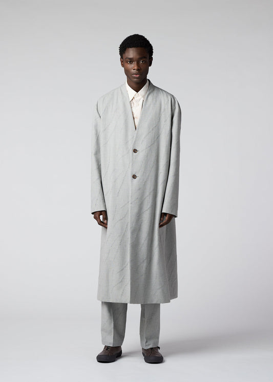 A model wears the IM MEN FLY WOOL coat.