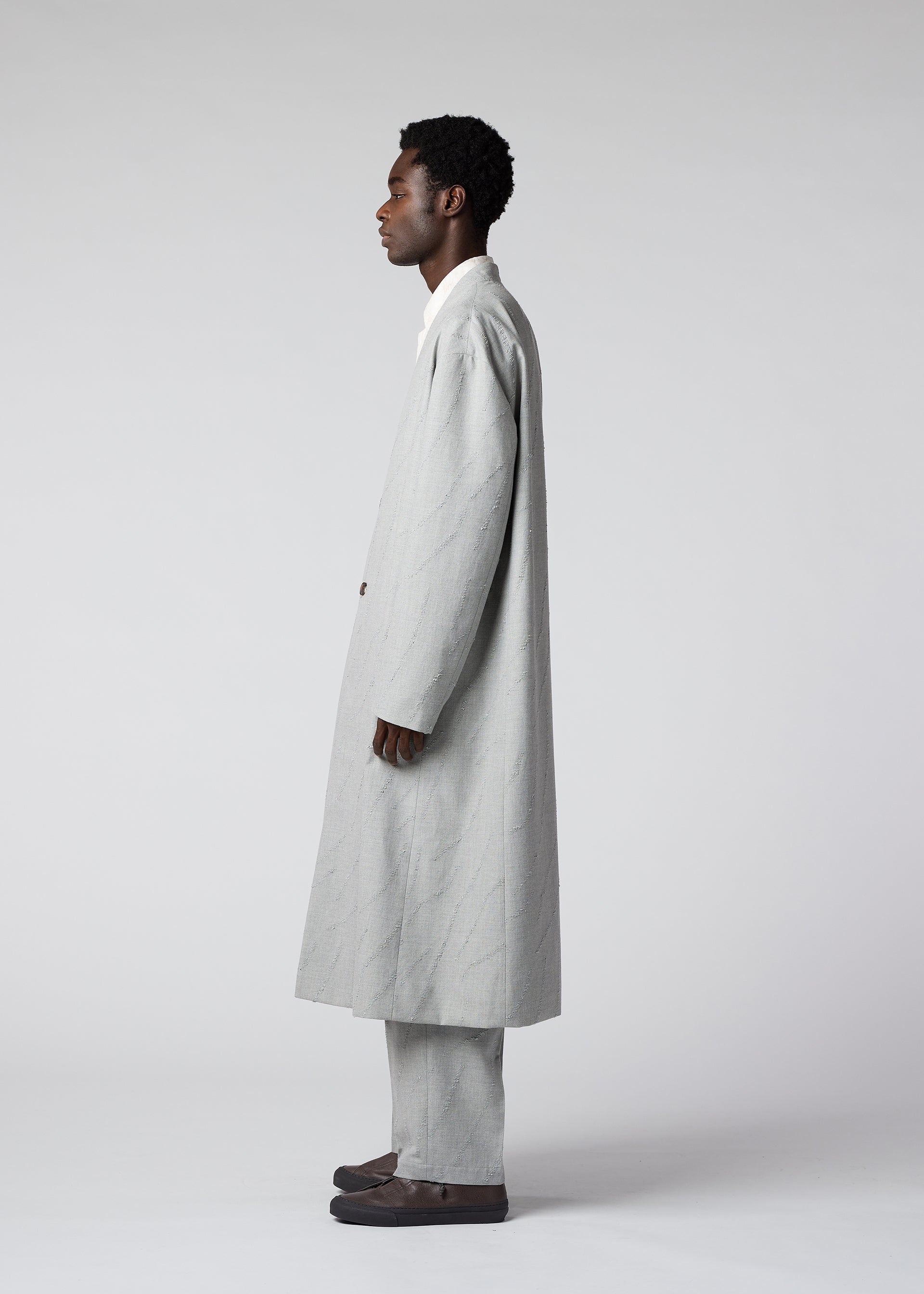 A model wears the IM MEN FLY WOOL coat.