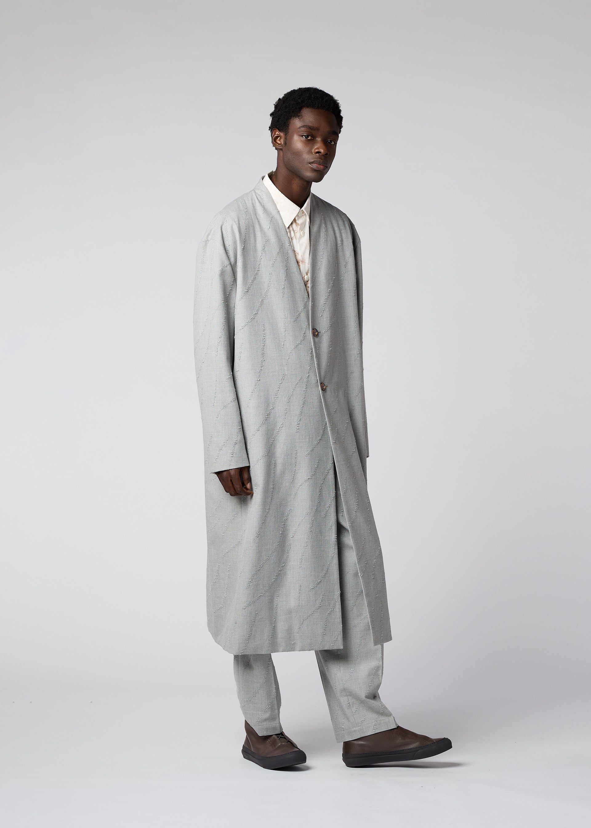 A model wears the IM MEN FLY WOOL coat.