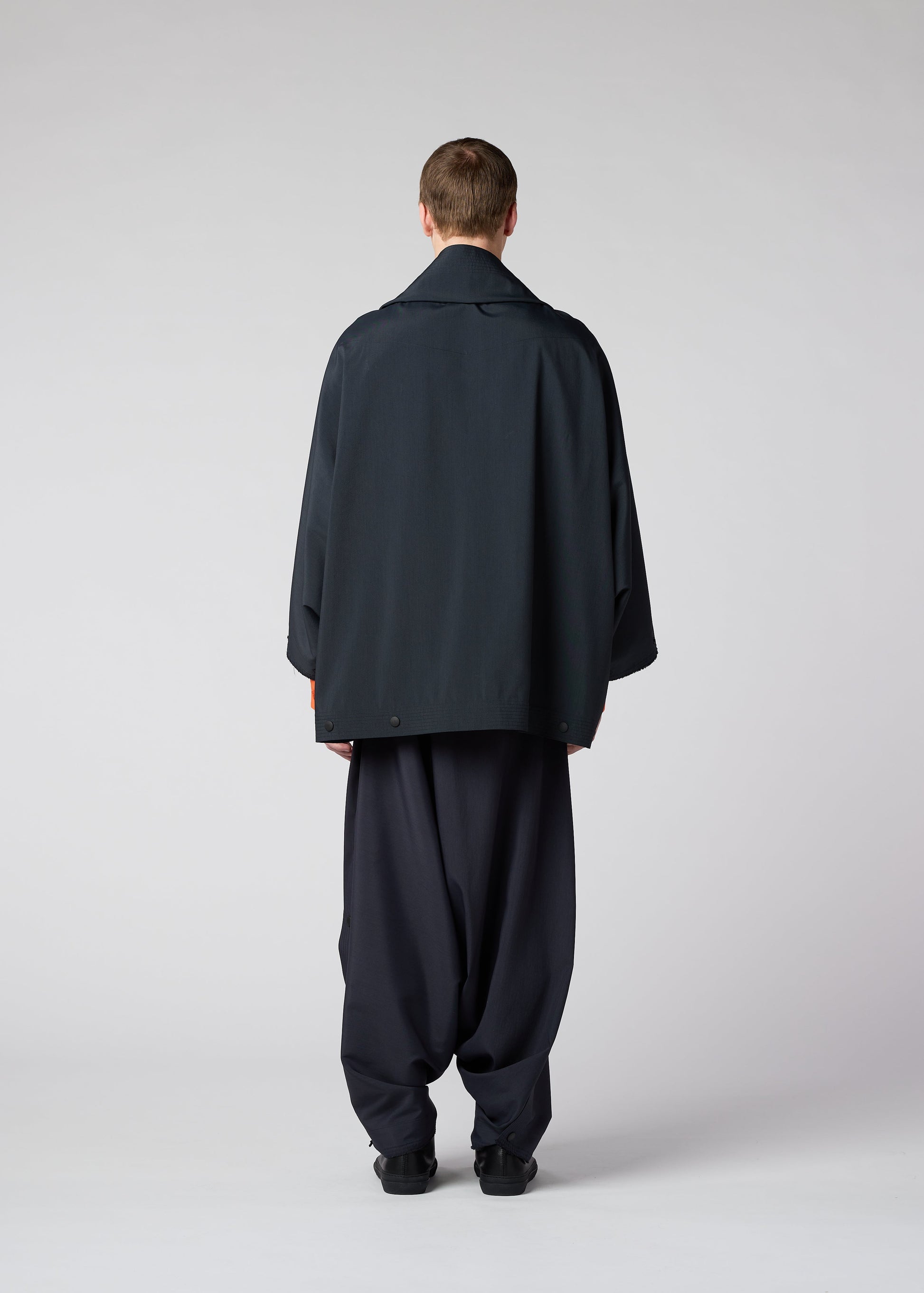 A model wears the IM MEN FLY jacket.