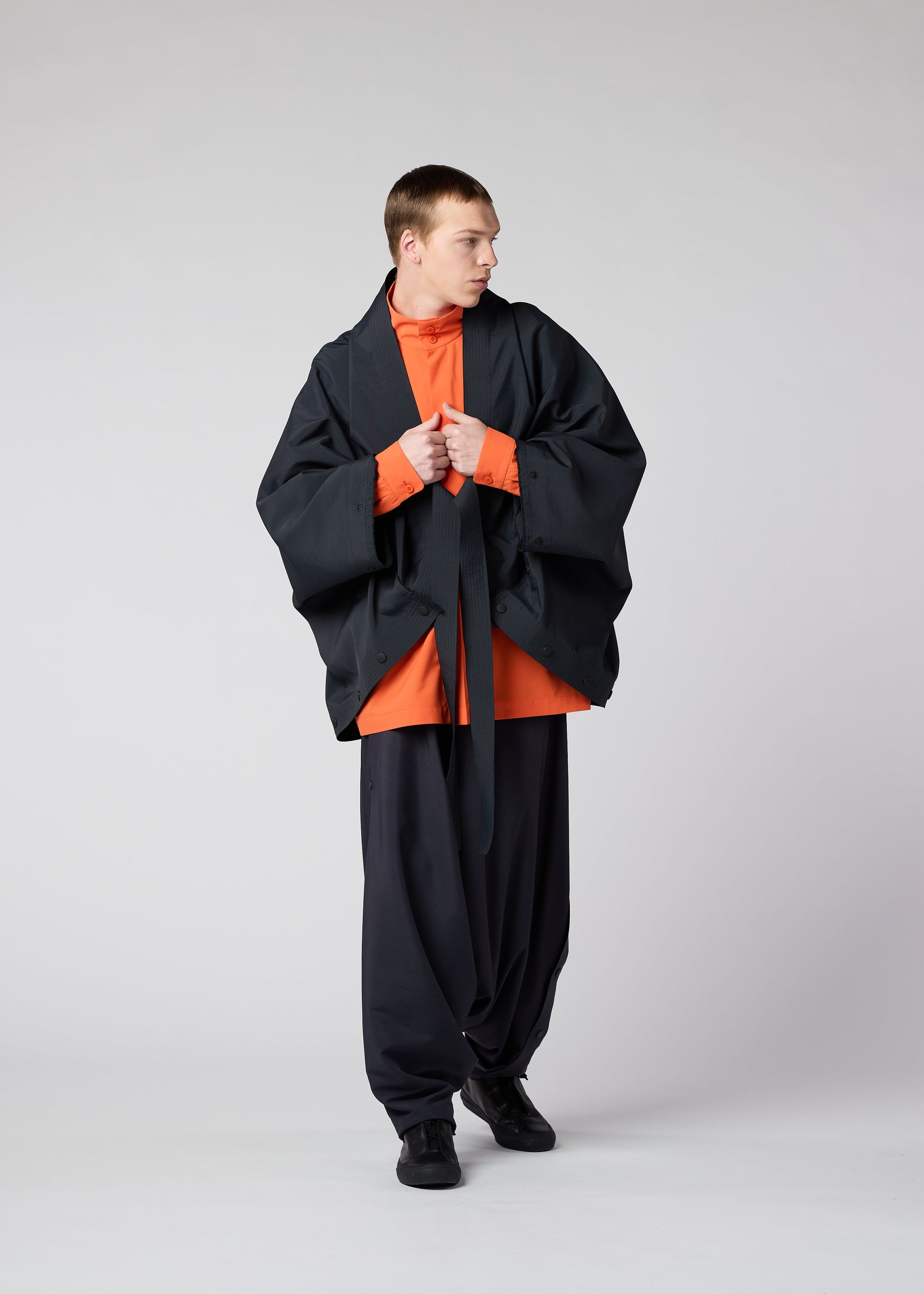 A model wears the IM MEN FLY jacket.