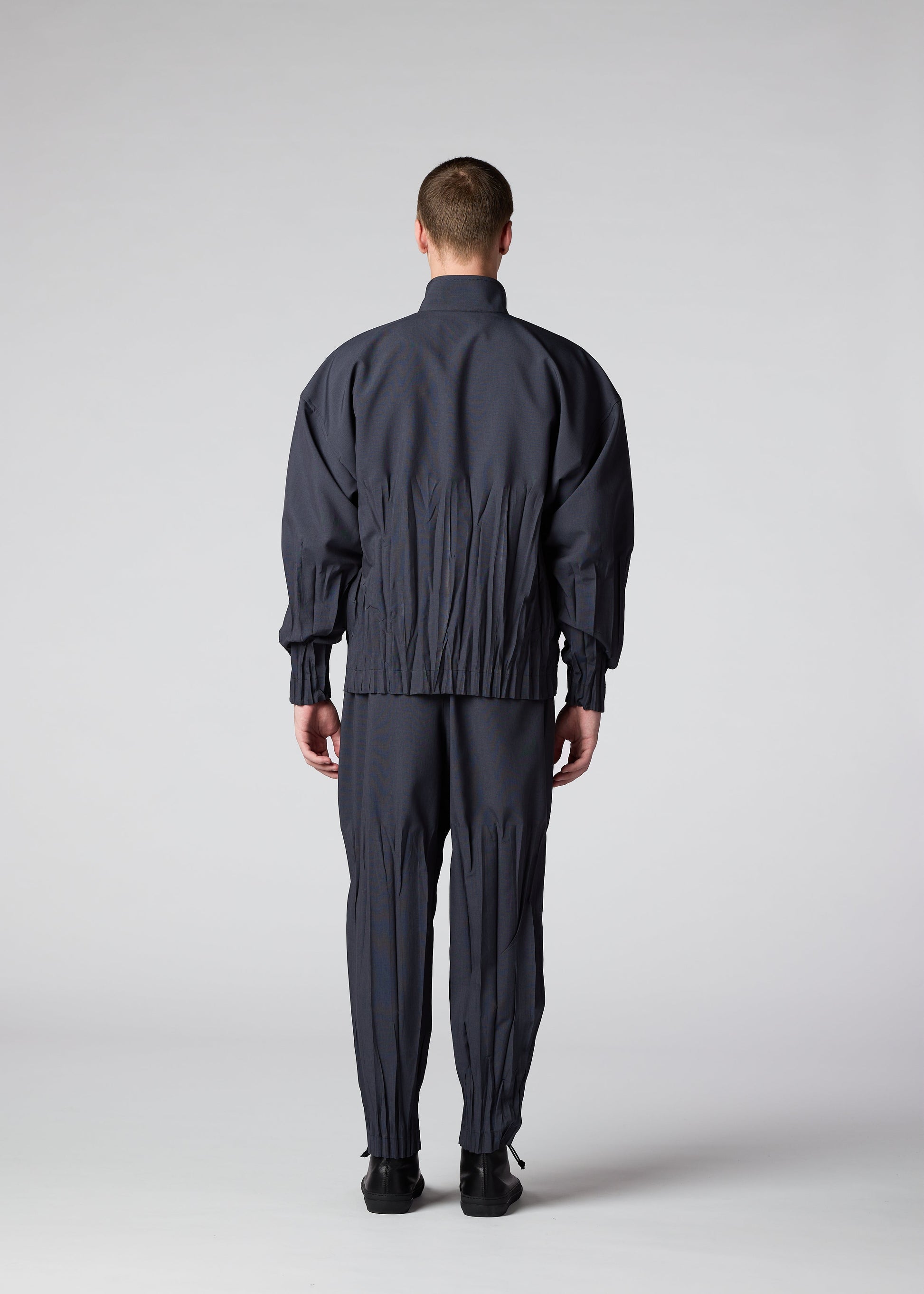 A model wears the IM MEN WAFT jacket.