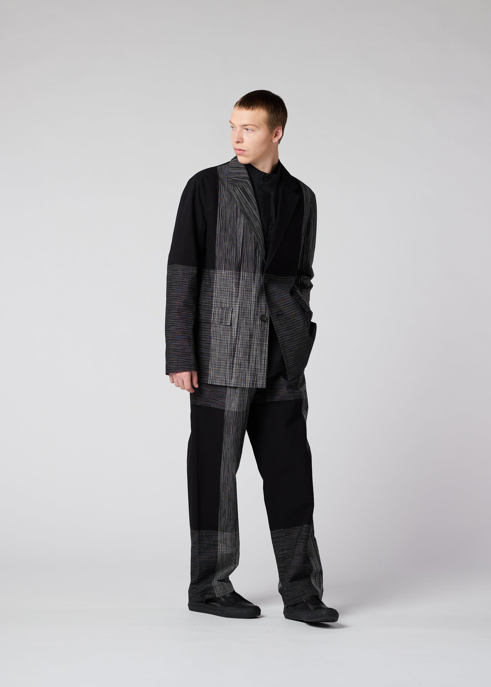 A model wears the IM MEN KASURI jacket.
