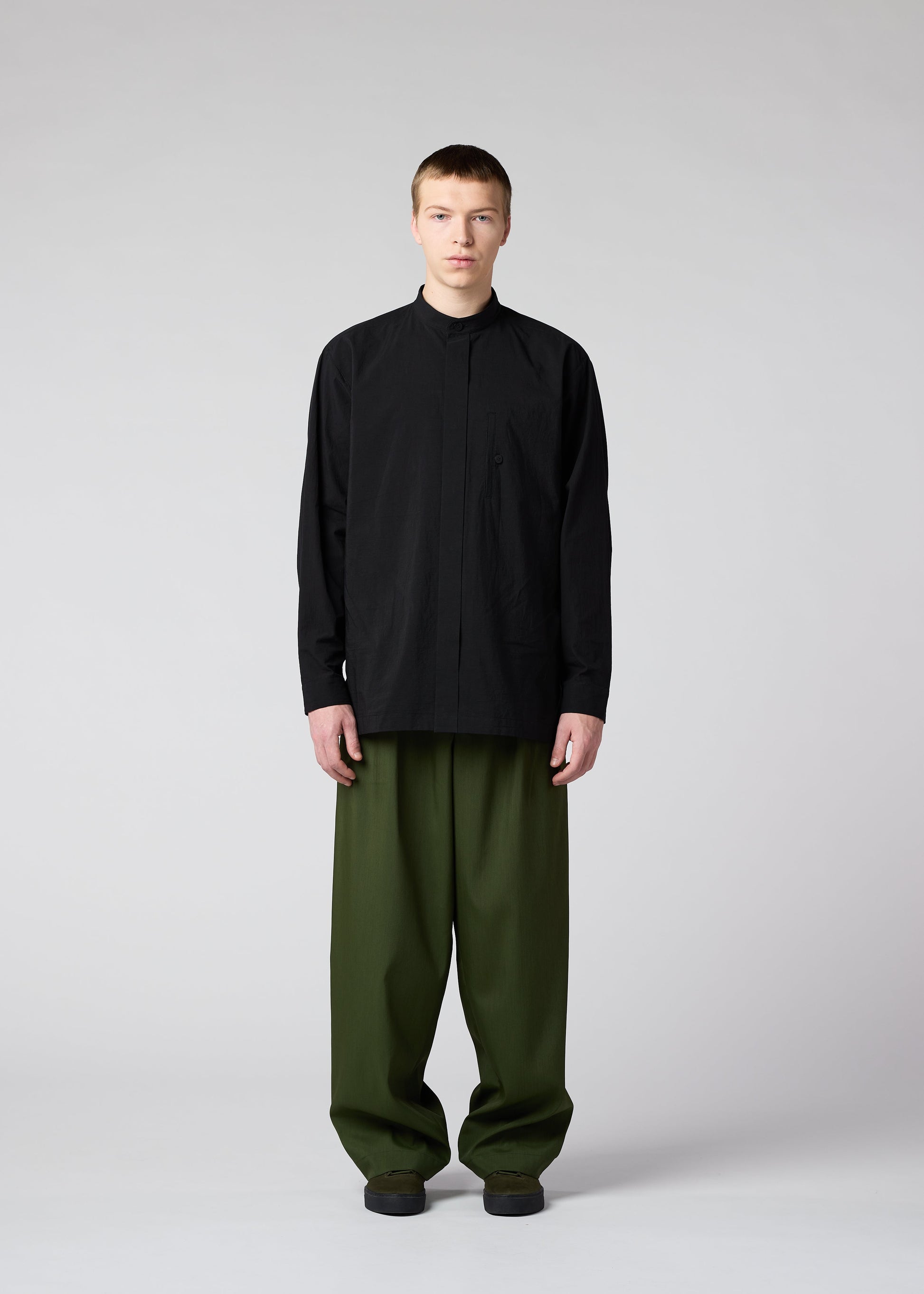 A model wears the IM MEN AIR trousers.