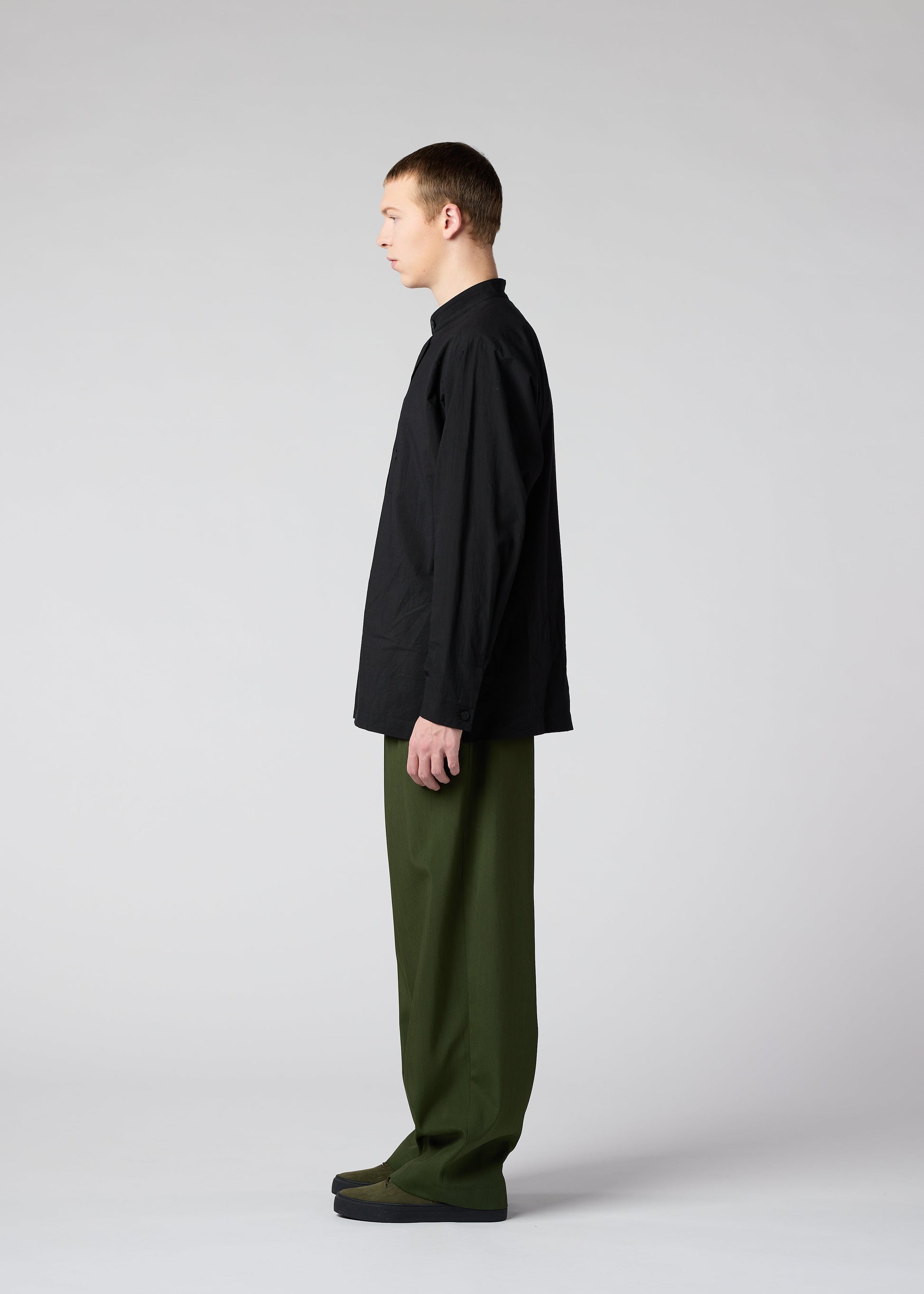 A model wears the IM MEN AIR trousers.