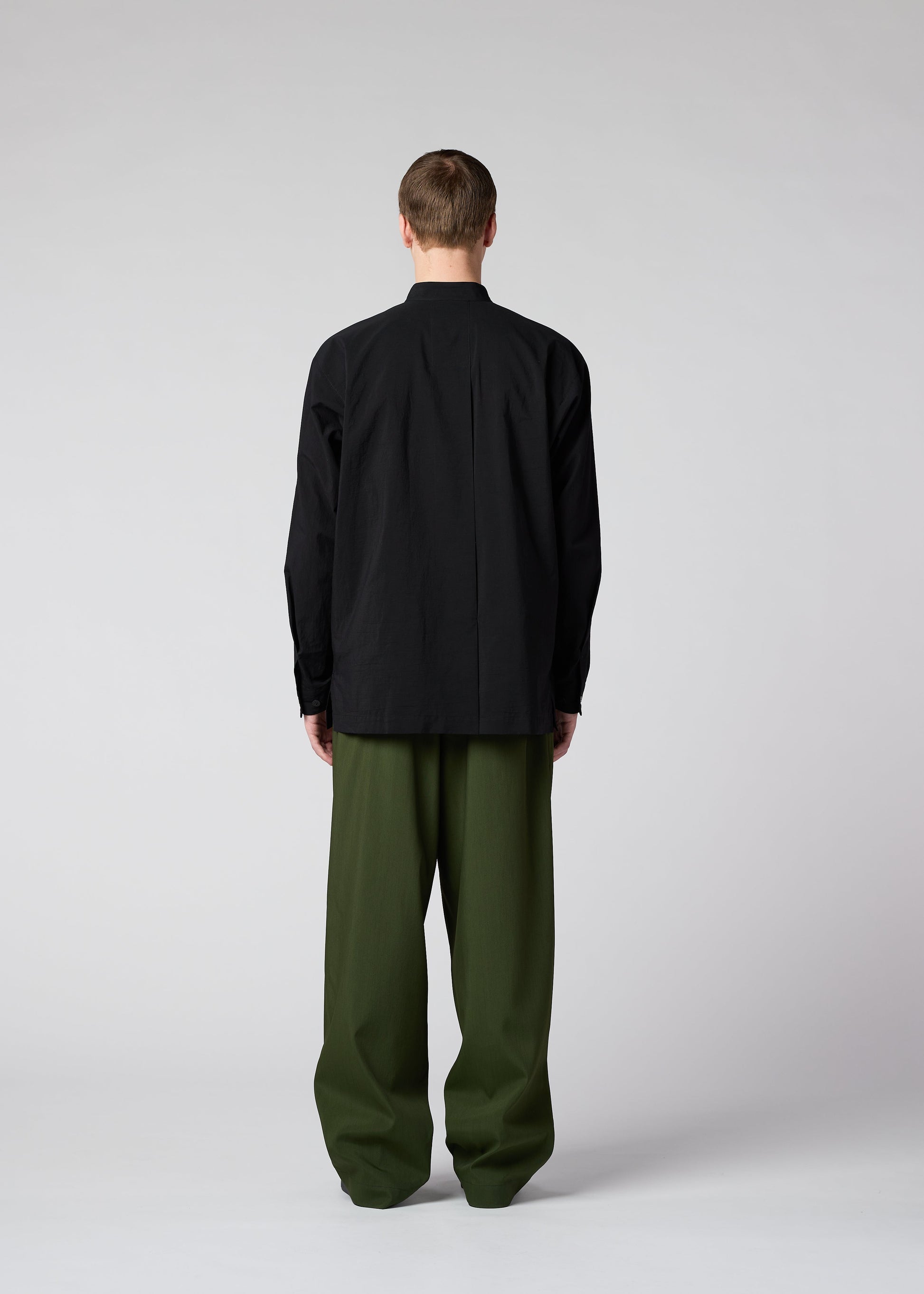 A model wears the IM MEN AIR trousers.