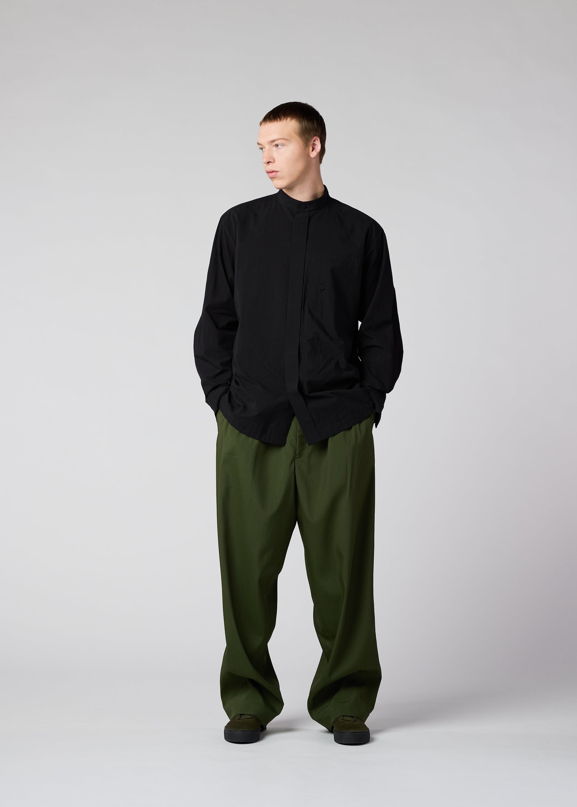 A model wears the IM MEN AIR trousers.