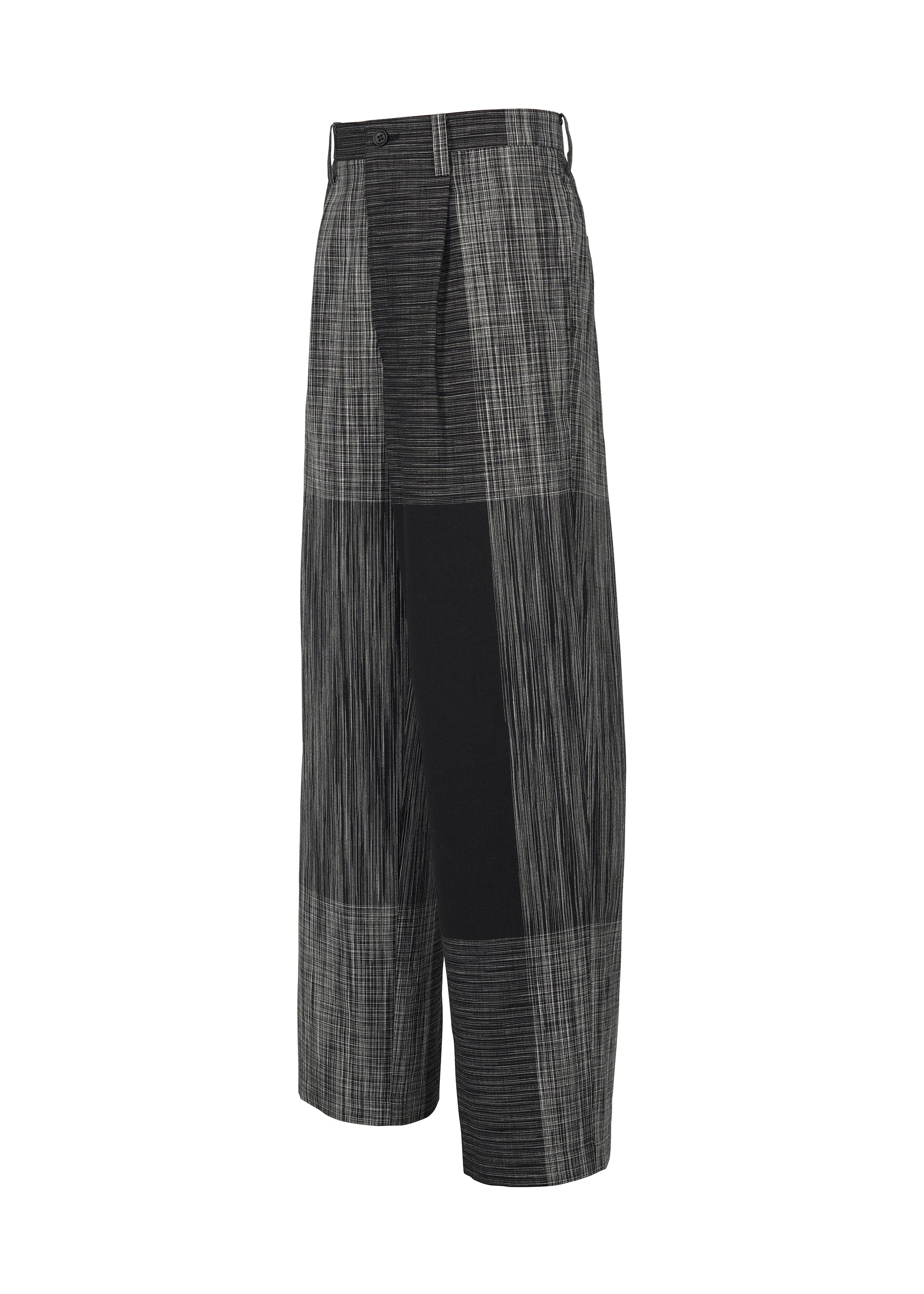 A detail shot of the IM MEN KASURI trousers.