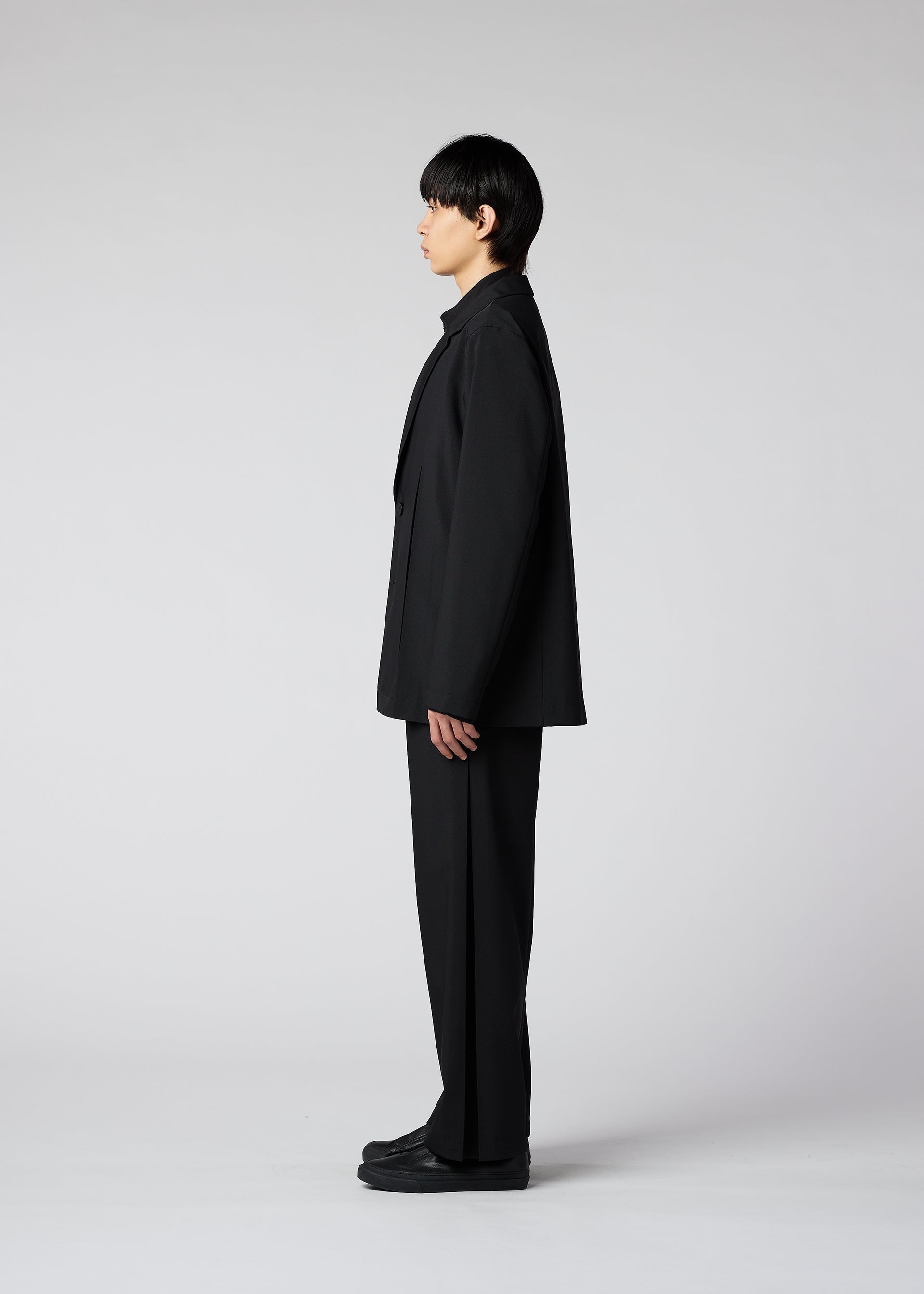 A model wears the IM MEN WINGS trousers.
